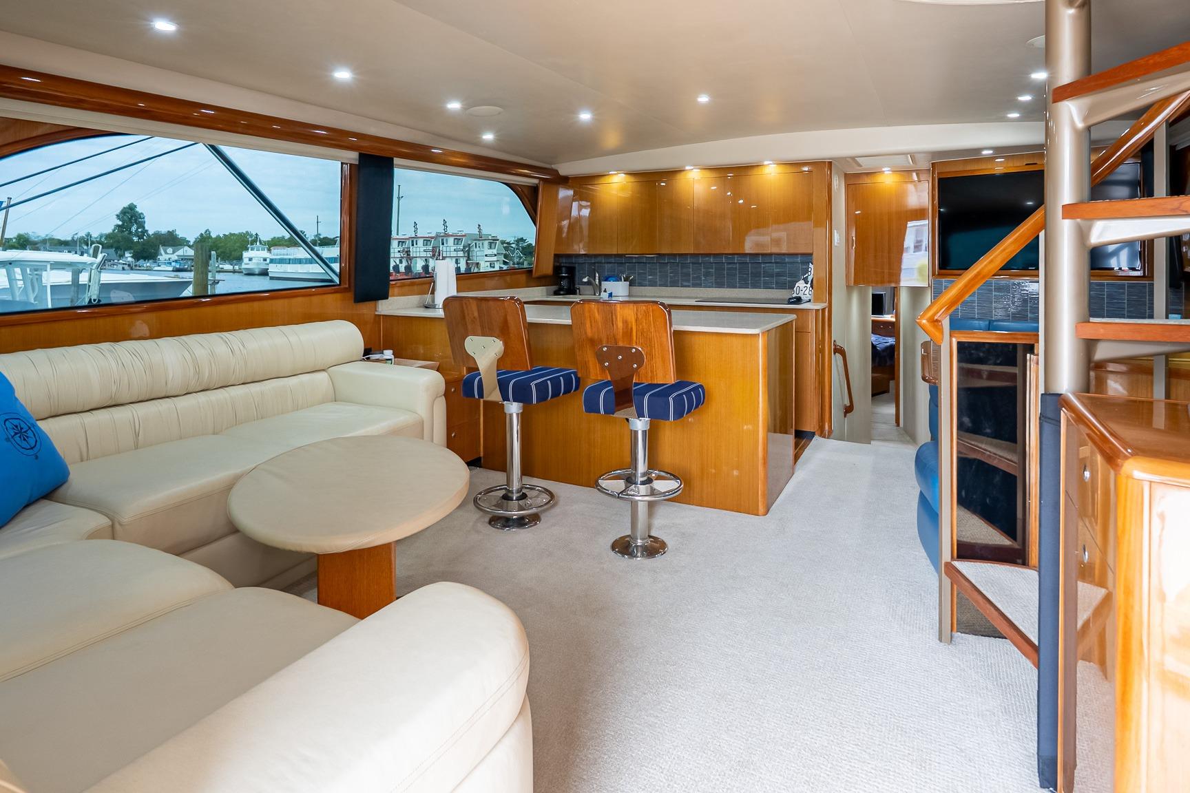 Luxurious interior of 2002 Viking 61 Enclosed Bridge yacht with modern furnishings.