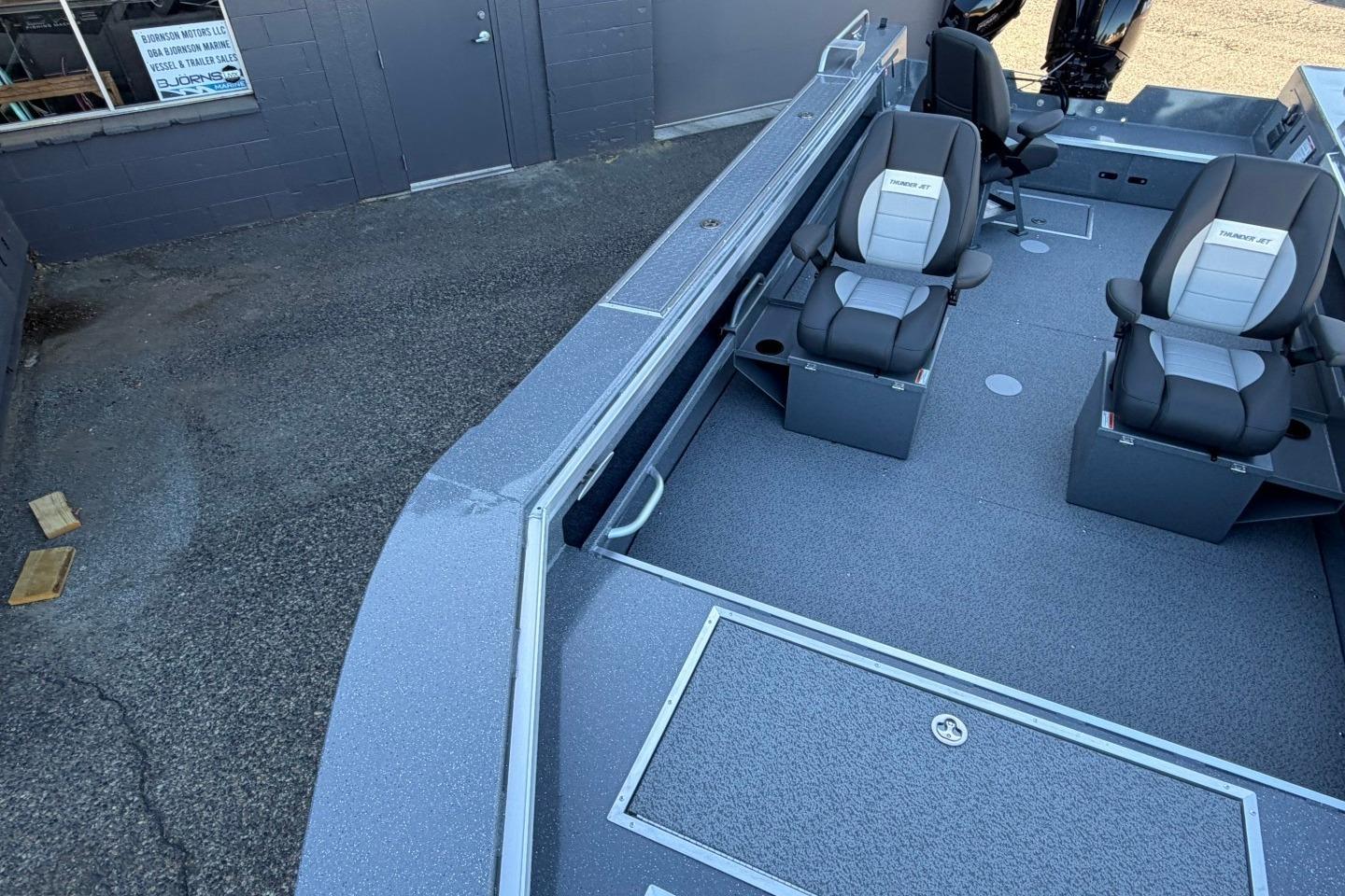 2026 Thunder Jet 209 Rush OT boat interior with seating and storage compartments.