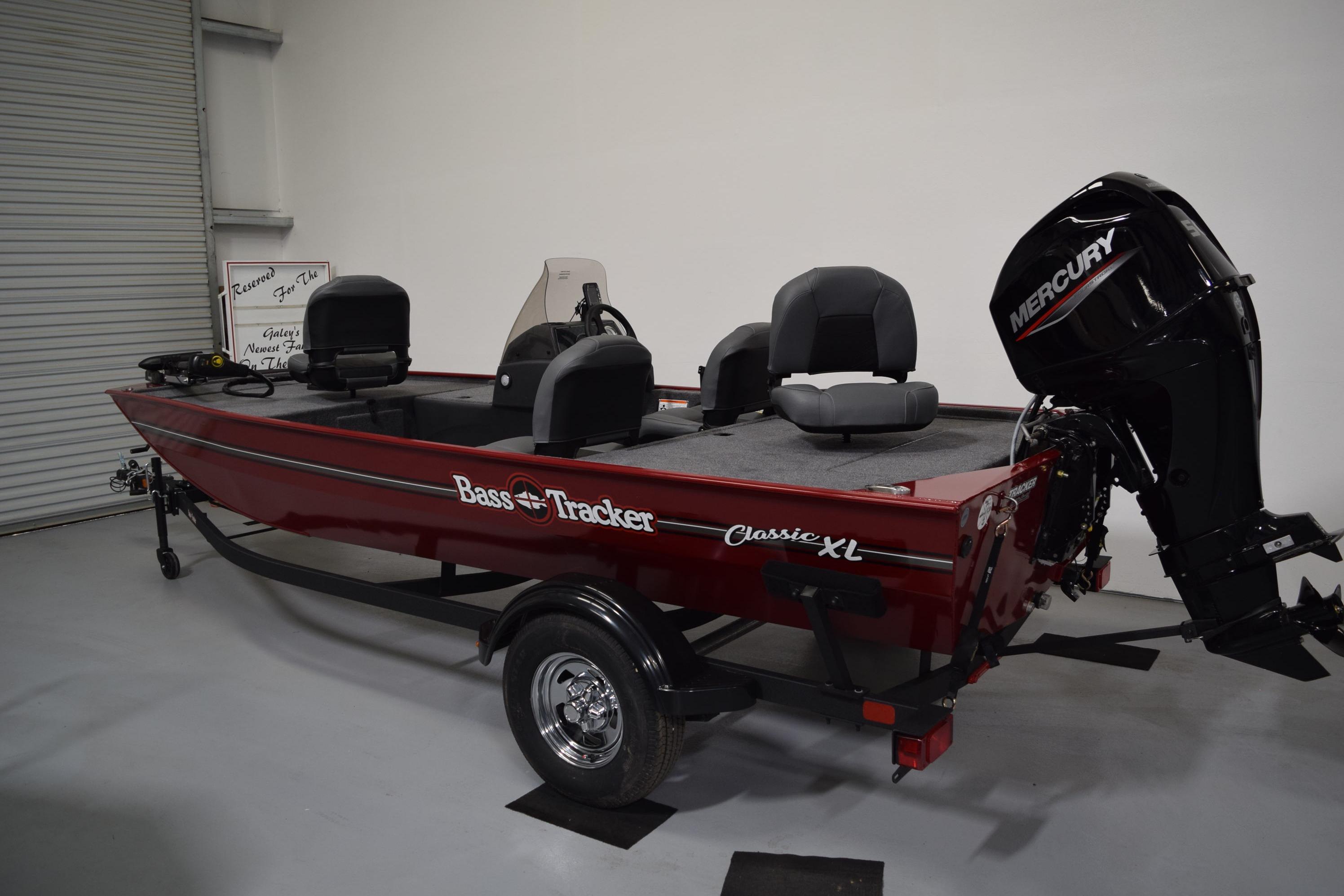 2026 Tracker Bass Tracker Classic XL boat with Mercury engine in showroom.