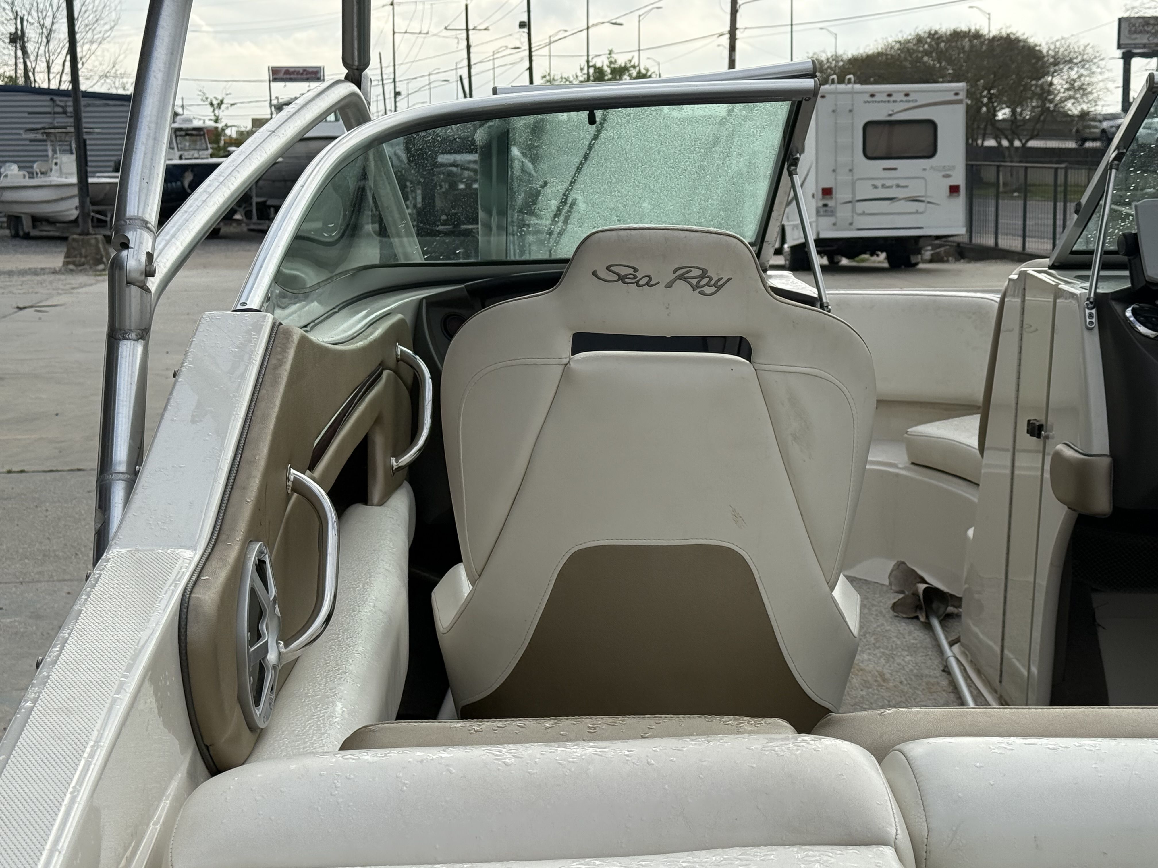 Interior of a 2007 Sea Ray 210 boat with wet seats.
