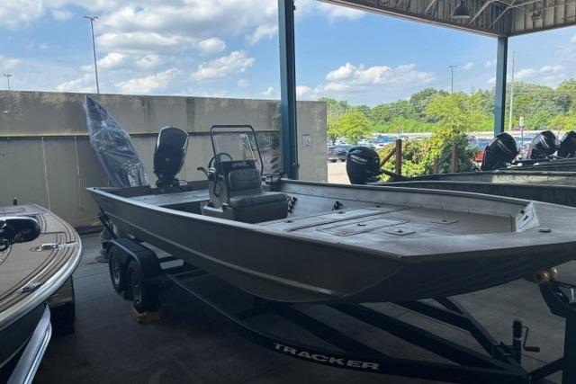 2026 Tracker Grizzly 2072 CC boat on trailer in outdoor showroom.