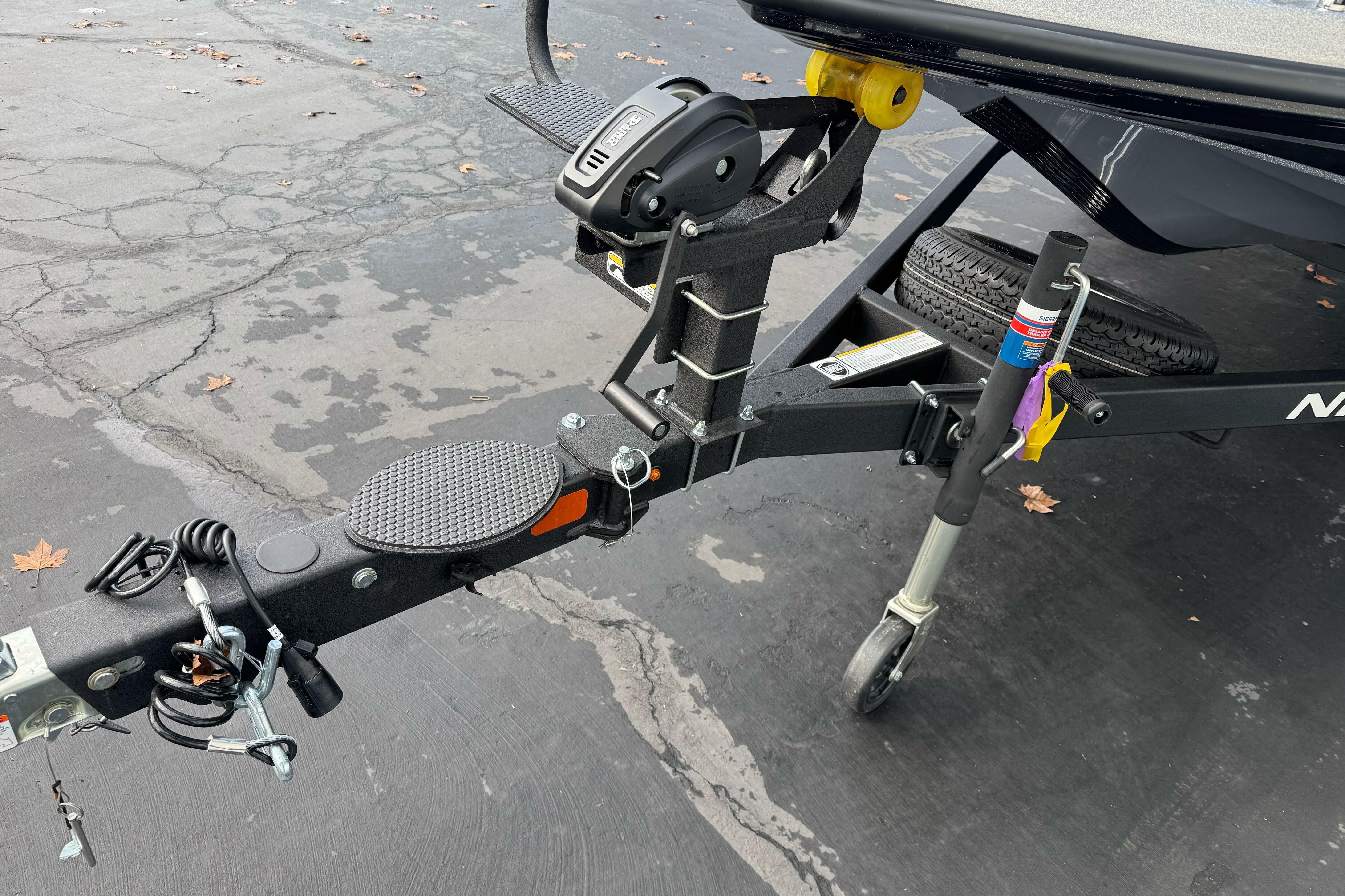 Trailer hitch of 2026 Nitro Z19 XL boat on asphalt surface.