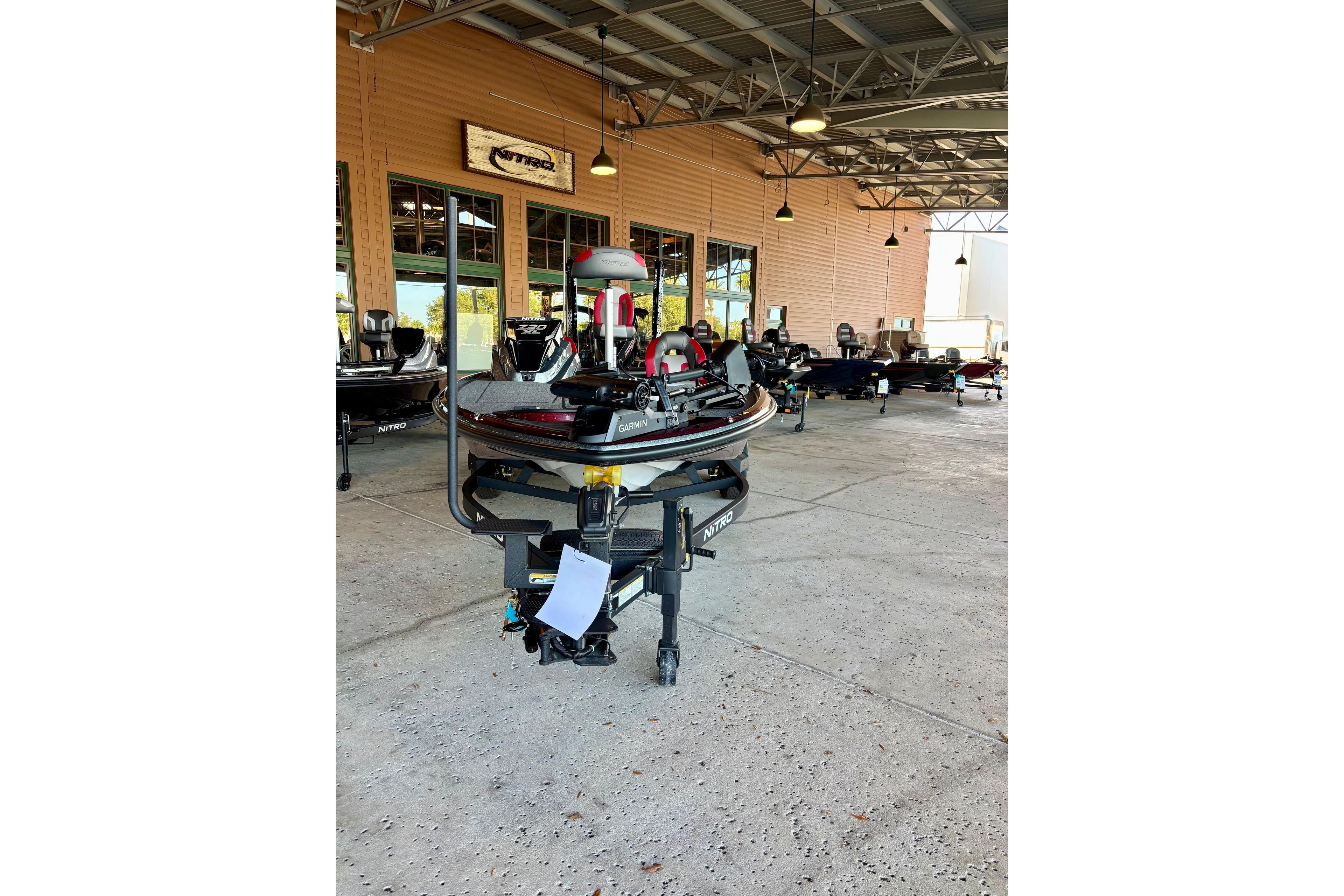 2026 Nitro Z20 XL Pro boat displayed in a showroom with other models.