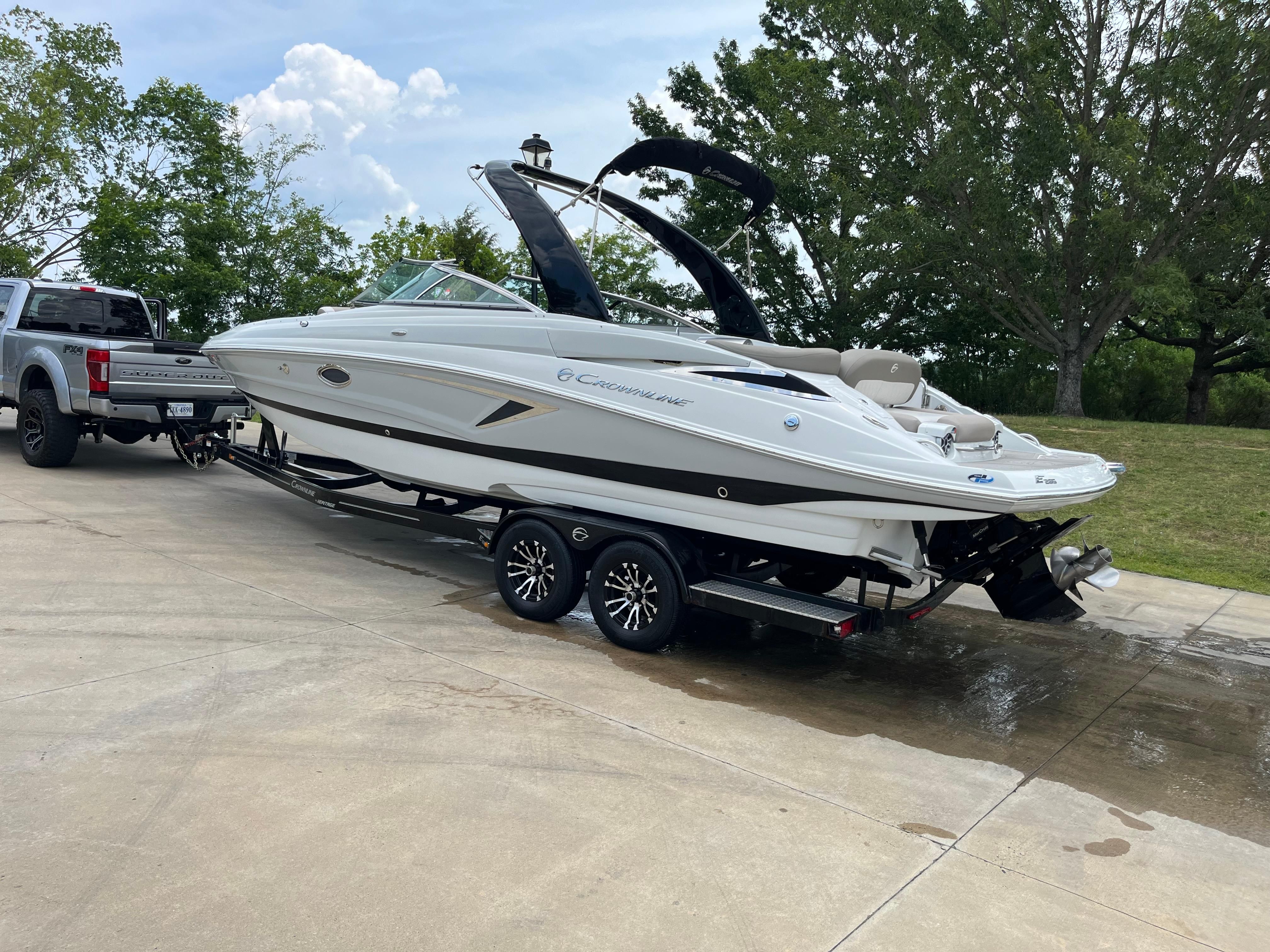 A 2019 Crownline E 285 boat on a trailer, ready for launch.