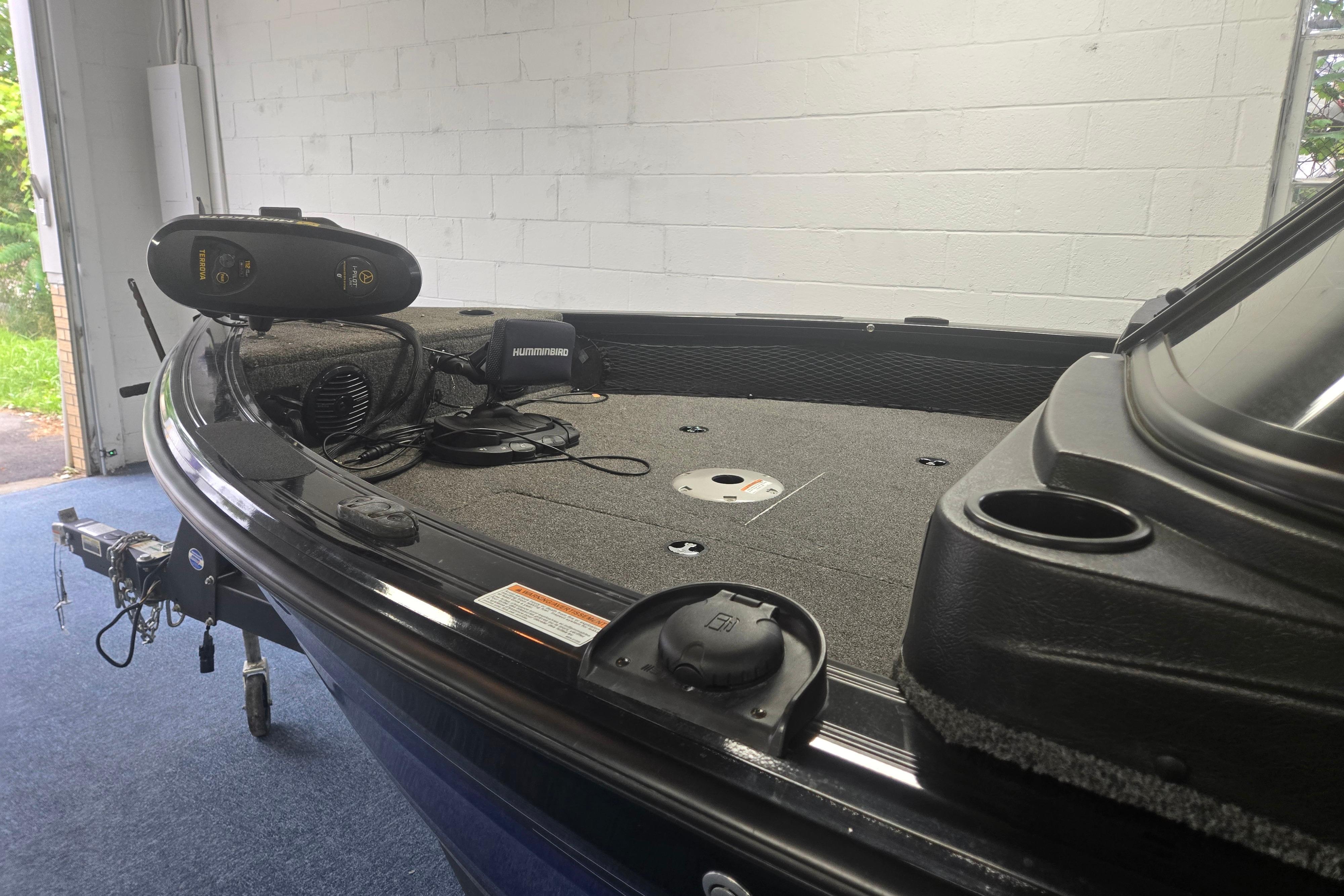 2020 Crestliner 1850 Raptor WT boat interior with fishing equipment and carpeted deck.