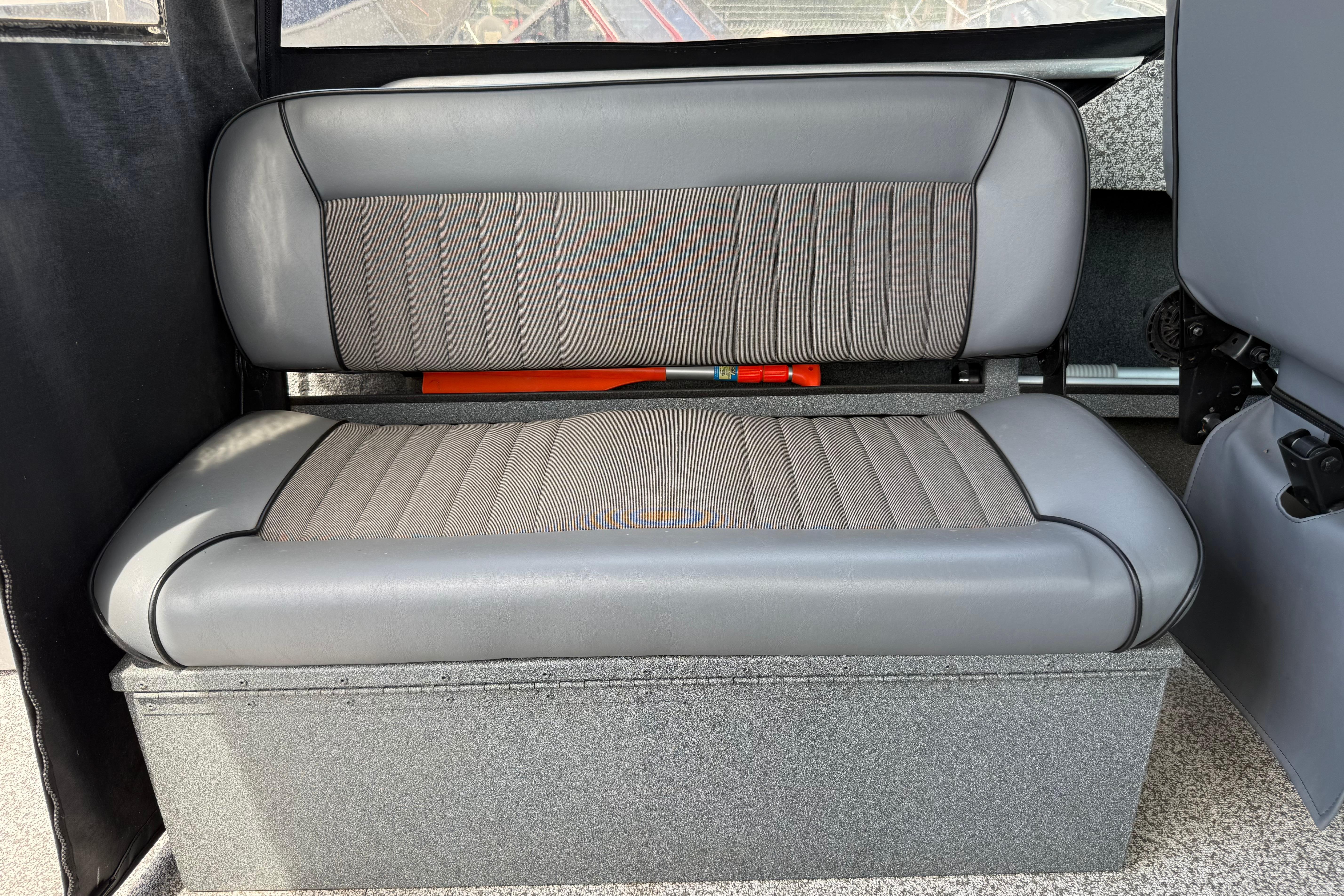 2019 Alumaweld Intruder Hard Top 22' interior seating, featuring gray cushioned bench.