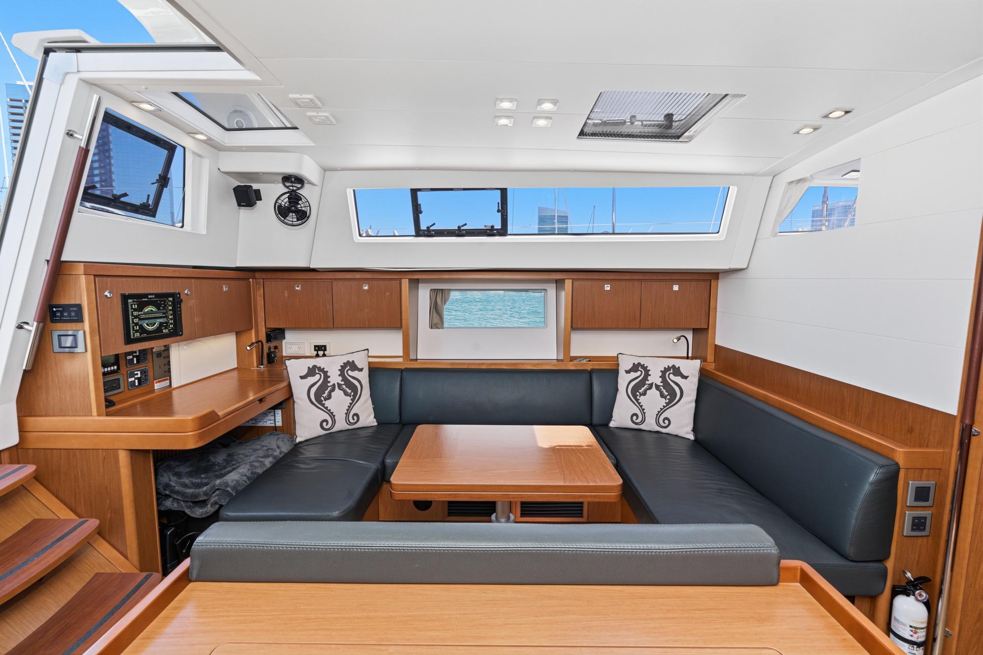 Luxurious interior of 2017 Beneteau Sense 50 yacht with modern seating and nautical decor.