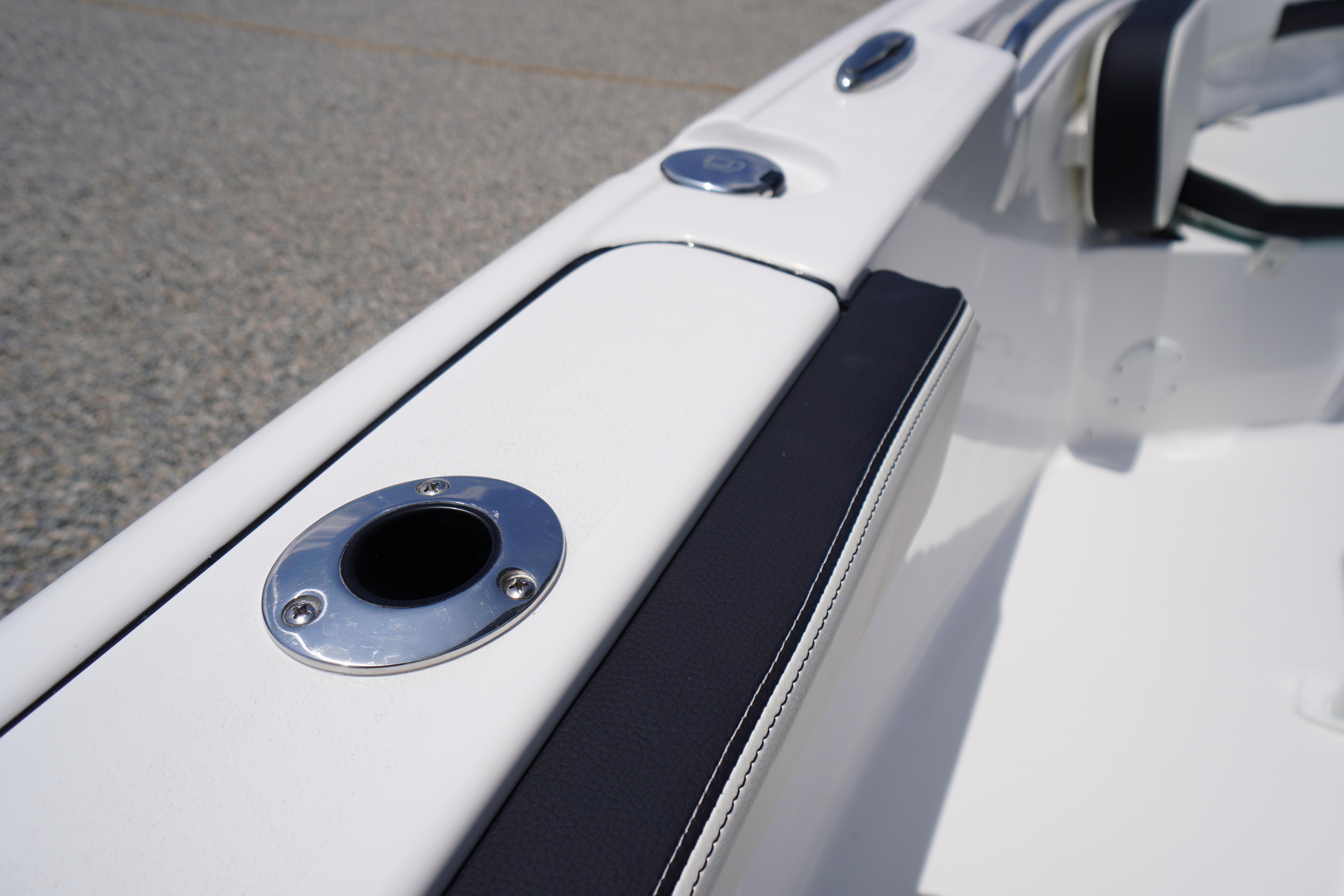 2027 Tidewater 220 CC Adventure boat interior detail with rod holder and seating.