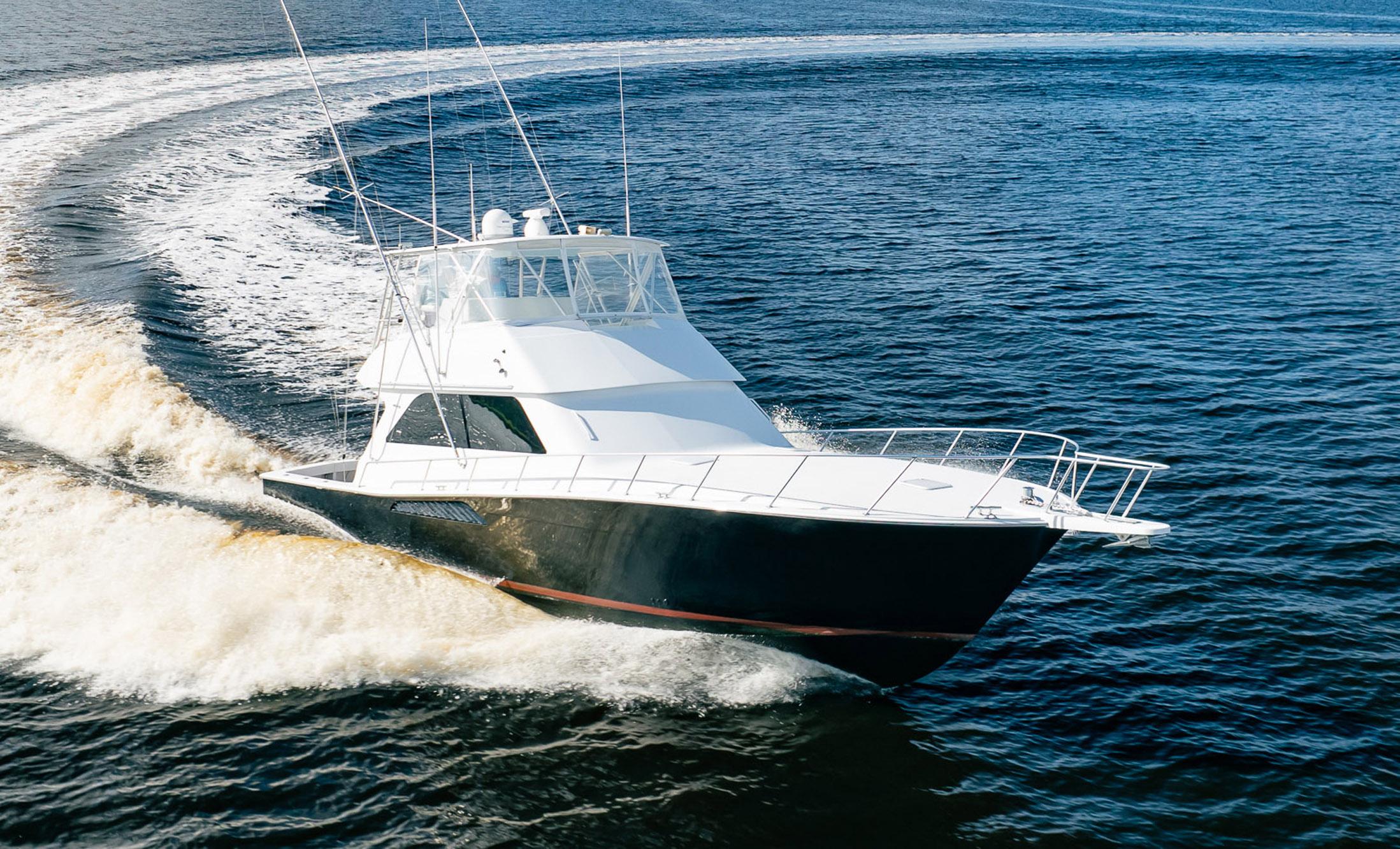 Viking 50 Conv Sport Fisher 2000 cruising on open water, creating a dynamic wake.