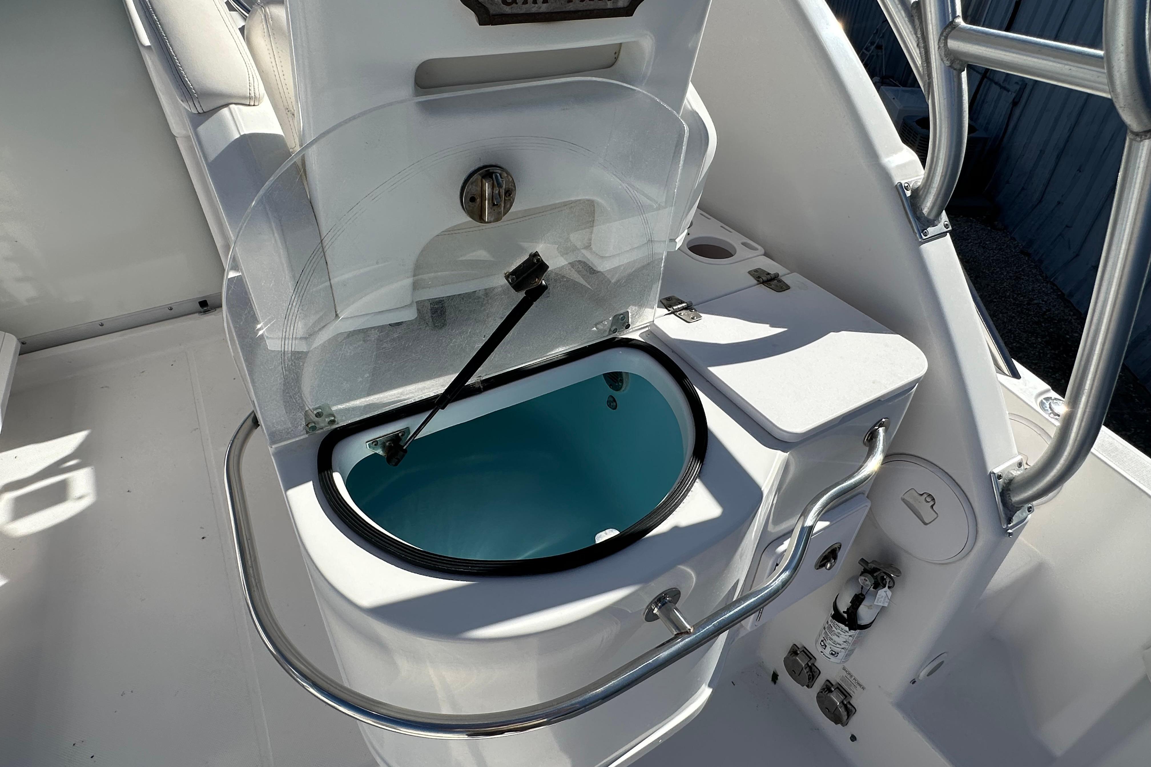 Livewell on 2006 Pro-Line 32 Express boat, featuring stainless steel railings and white interior.