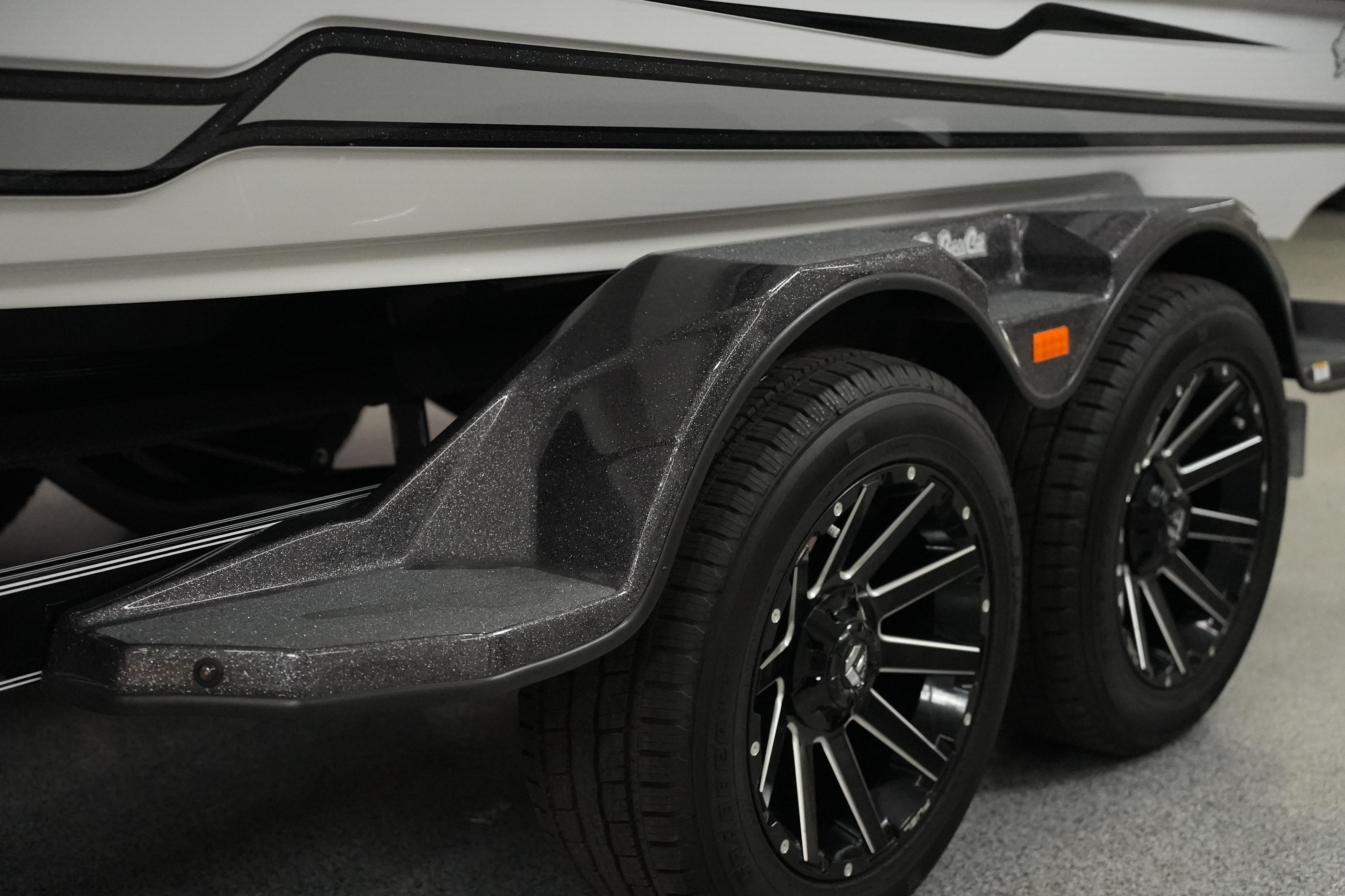 2026 Bass Cat Puma STS trailer with sleek black wheels and modern design.