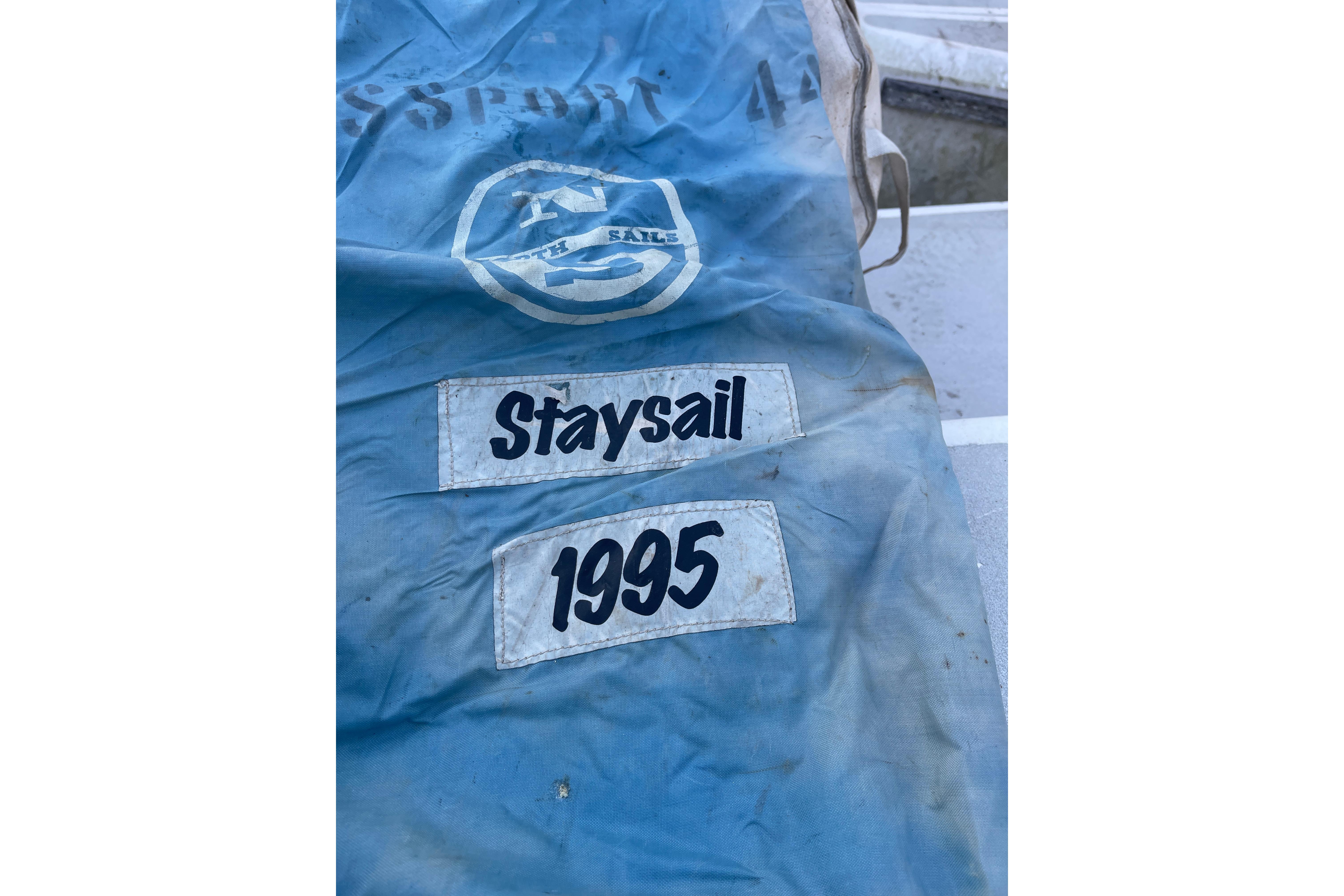 Blue staysail bag labeled "Staysail 1995" from Passport 47 AC Plan B yacht.