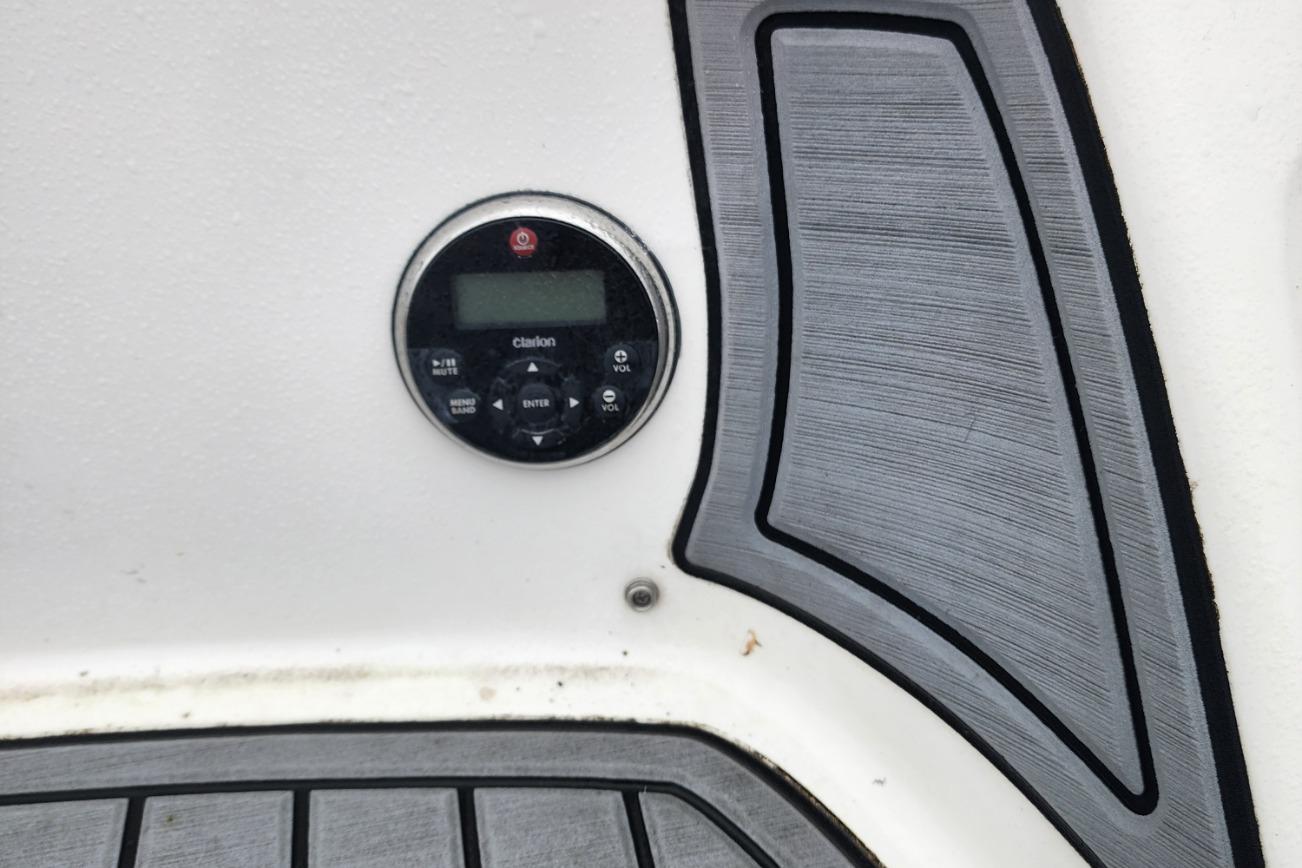 Control panel on 2015 Yamaha Boats 212X with textured flooring.