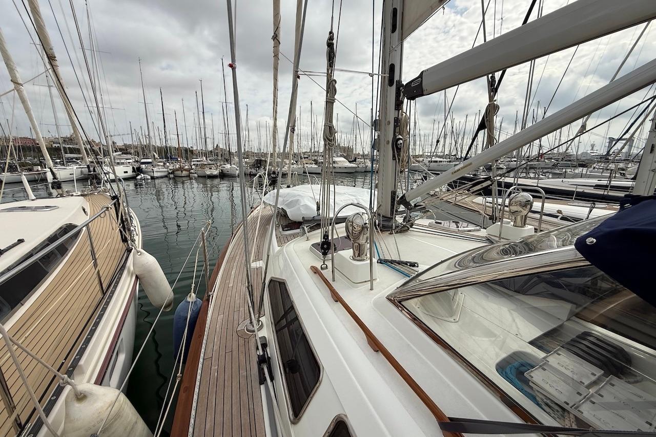 Sailboats docked in a marina, featuring a 2002 Moody 47 yacht.