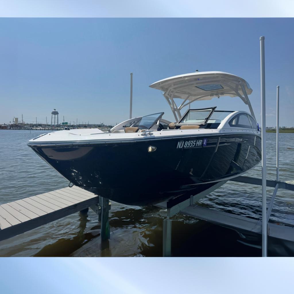 2022 Yamaha Boats 275SD docked on a sunny day, showcasing sleek design and modern features.