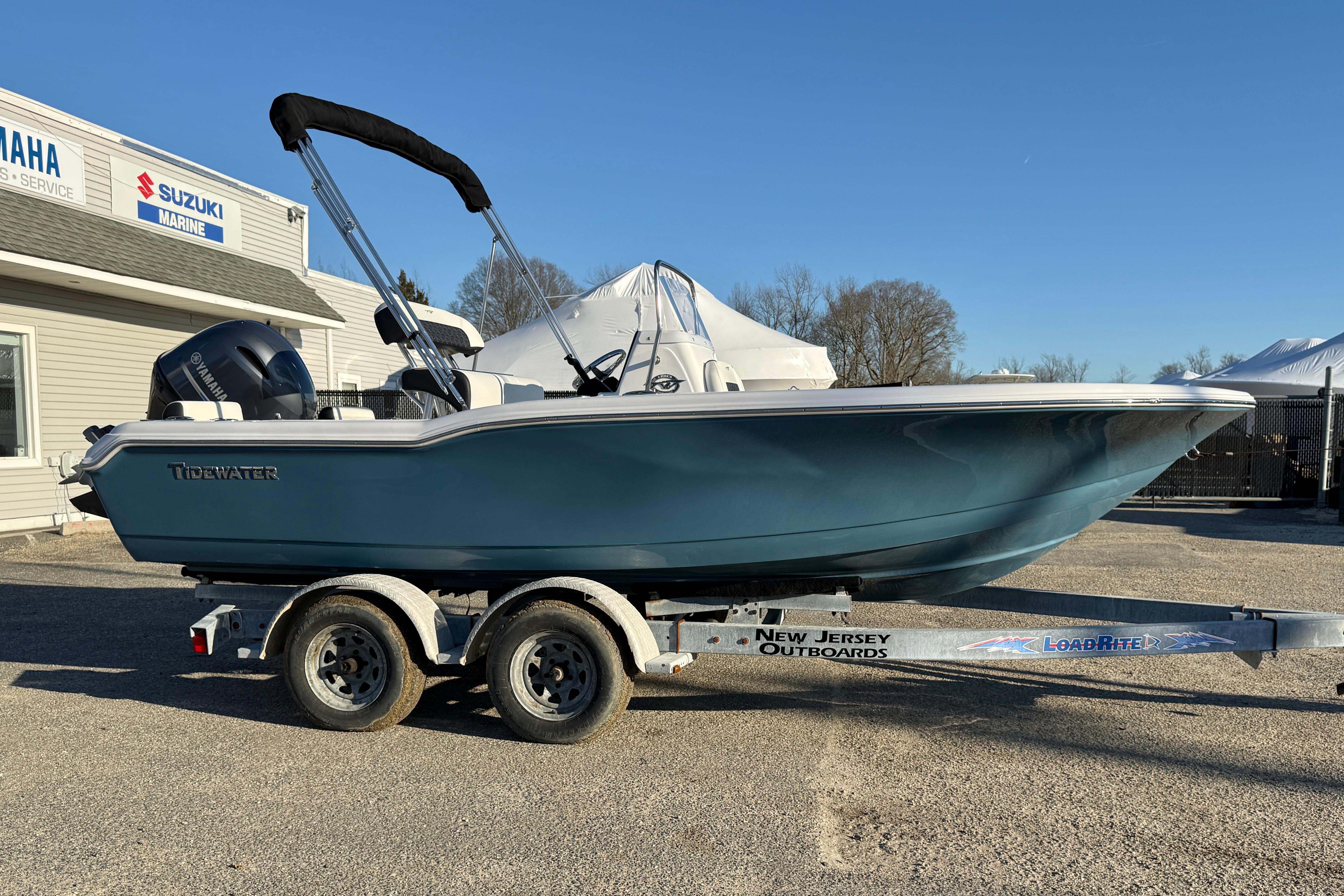2026 Tidewater 180 CC Adventure boat on trailer at dealership.