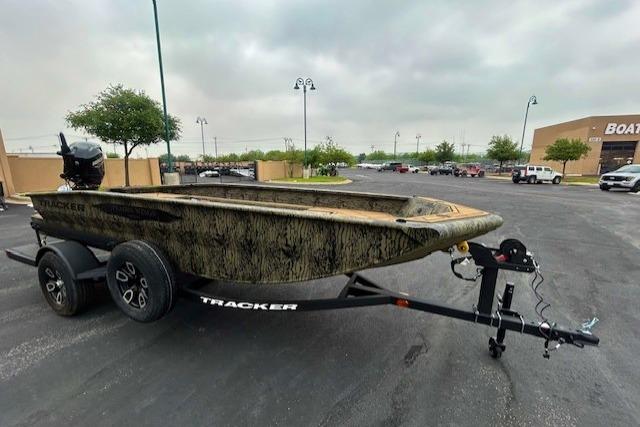 2026 Tracker Grizzly 1650 T Prairie Wings Edition boat on trailer in parking lot.