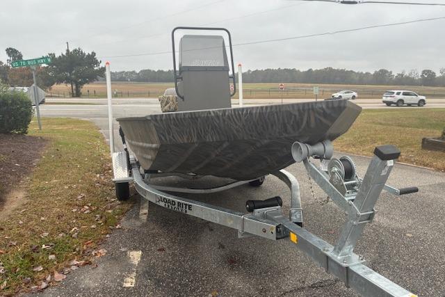 2026 Alweld 1760VV Marsh Console CC boat on trailer, parked roadside.