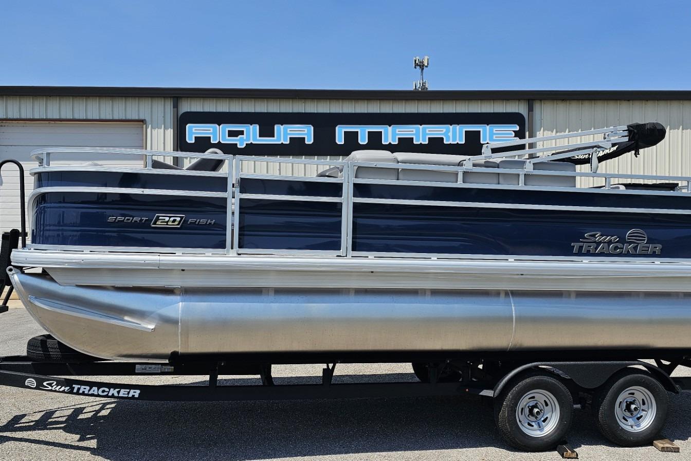 2026 Sun Tracker SportFish 20 DLX pontoon boat on trailer at Aqua Marine.