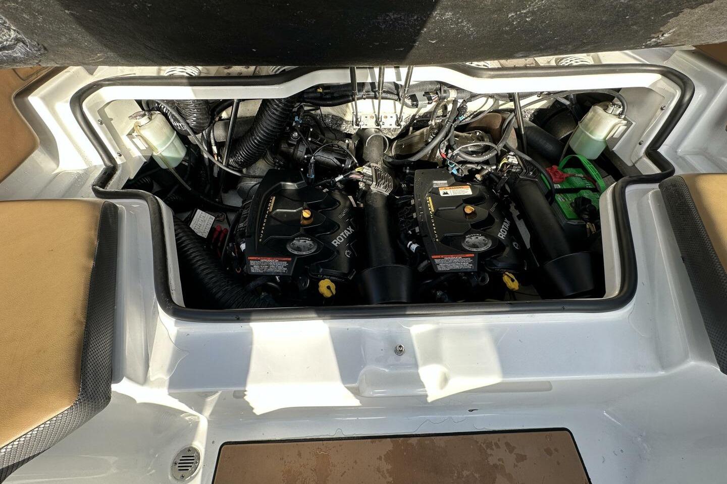 Engine compartment of a 2021 Scarab 215 boat, featuring dual Rotax engines.