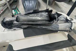 2022 Robalo R247 Dual Console boat interior with protective covers.
