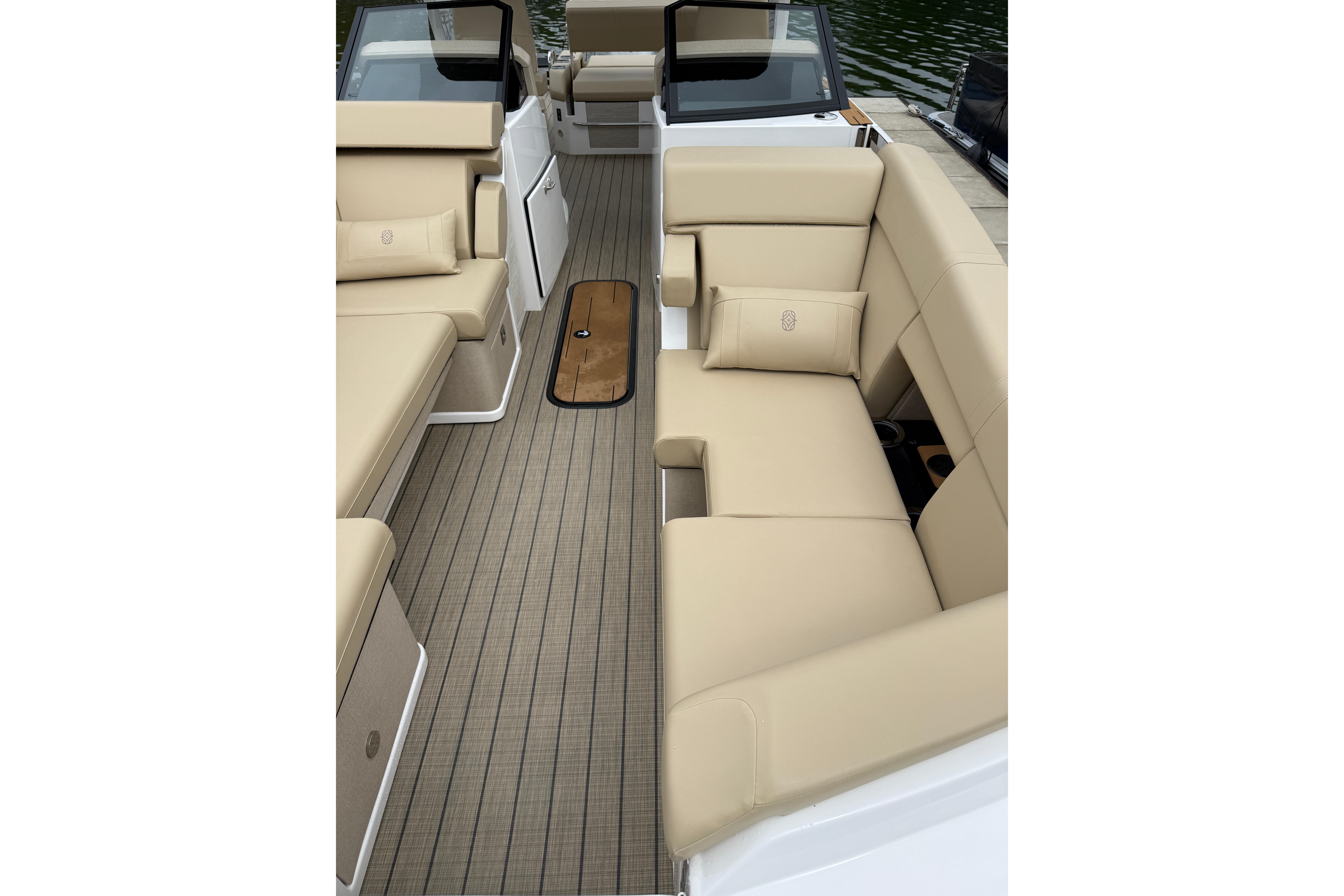 Luxurious interior of 2025 Balise Helix 26 L boat with beige seating and sleek design.