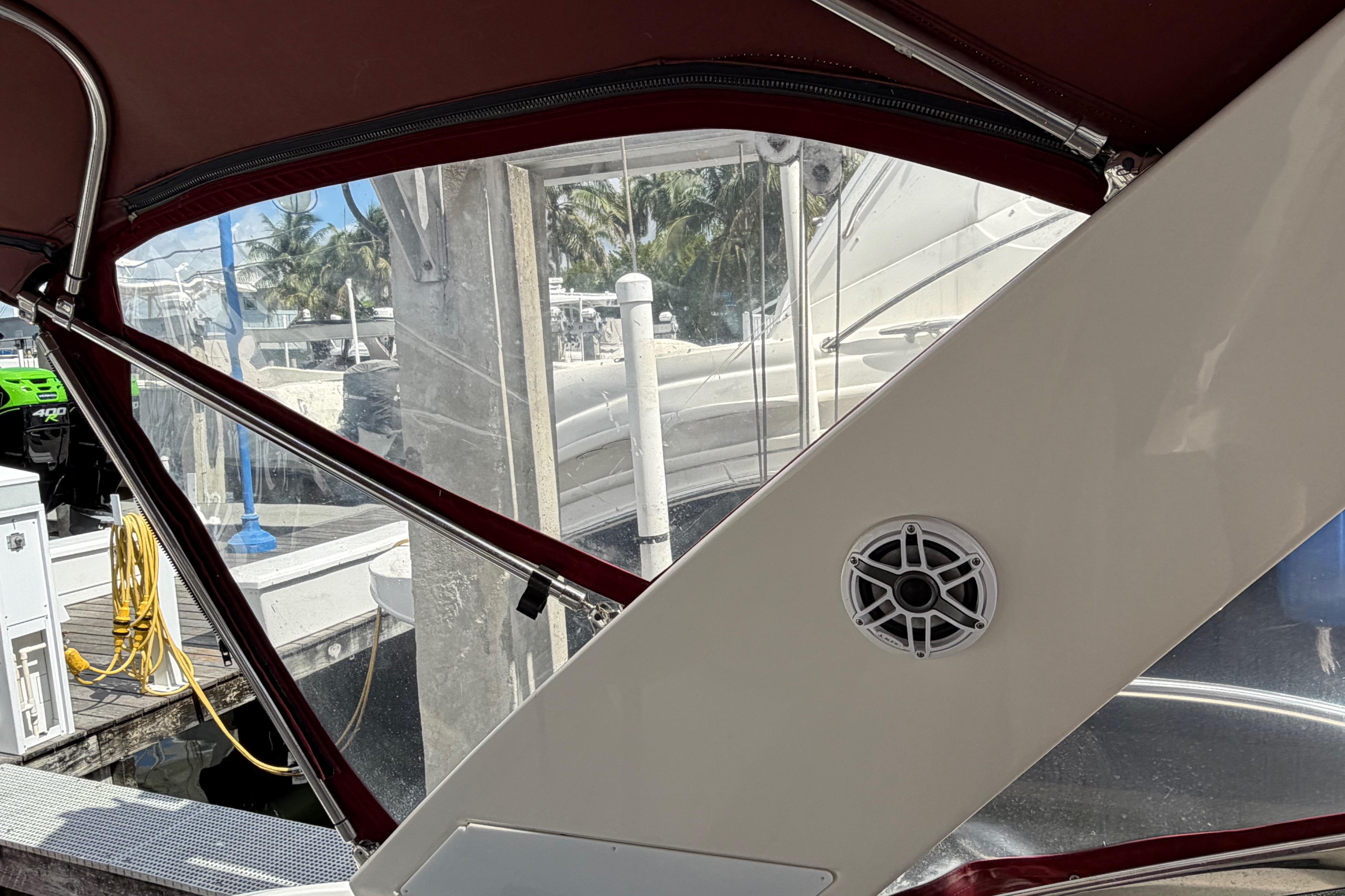 Interior view of a 2007 Monterey 350 Sport Yacht, featuring a speaker and marina backdrop.