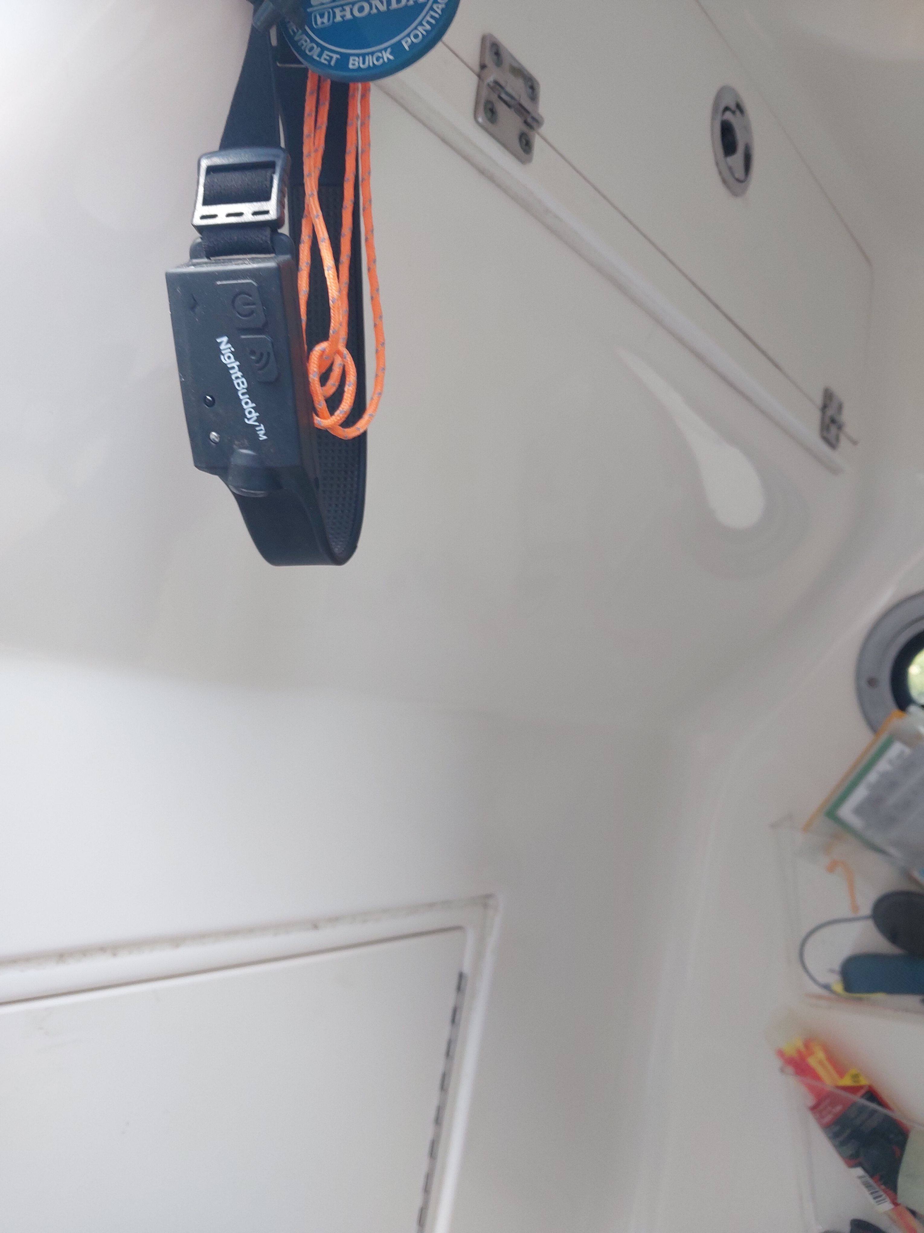 Interior view of a boat with storage and safety equipment.