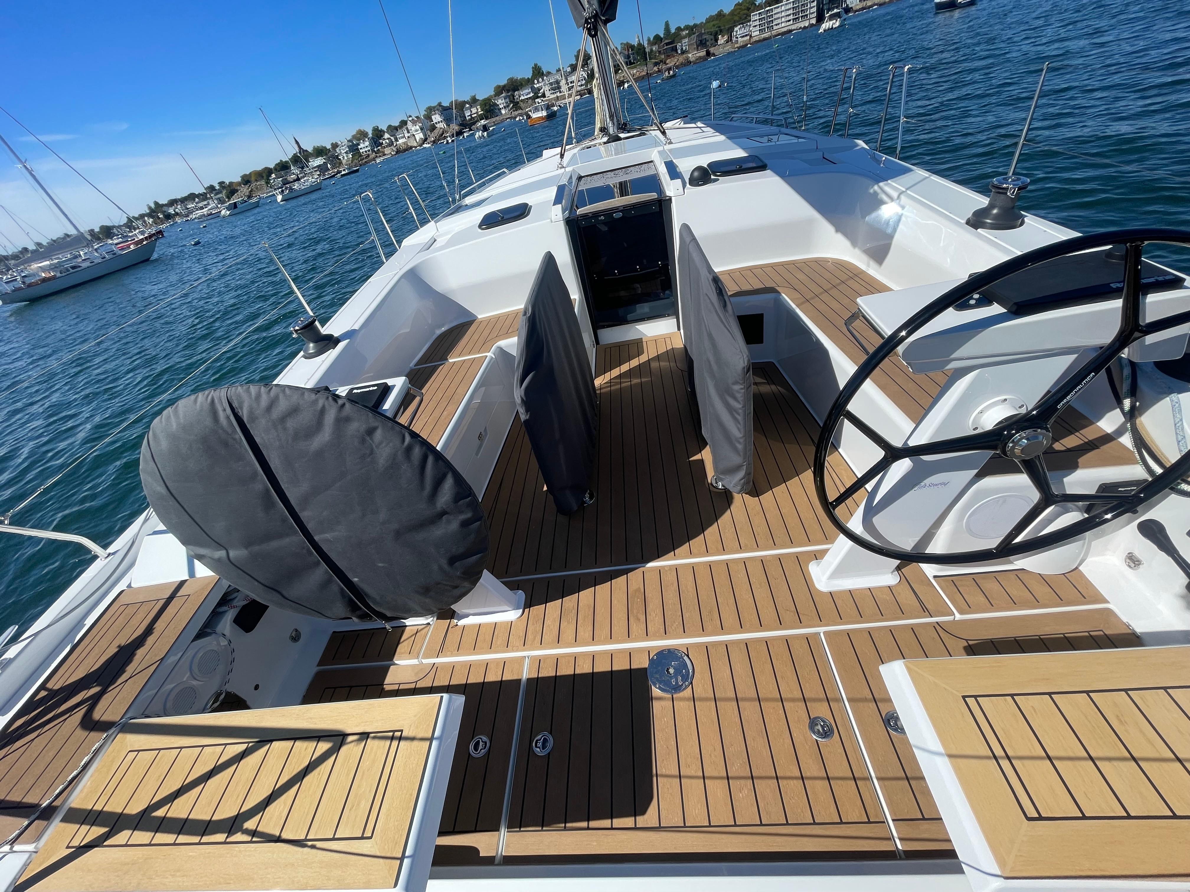 2024 Hanse 410 yacht with sleek deck design and dual steering wheels.