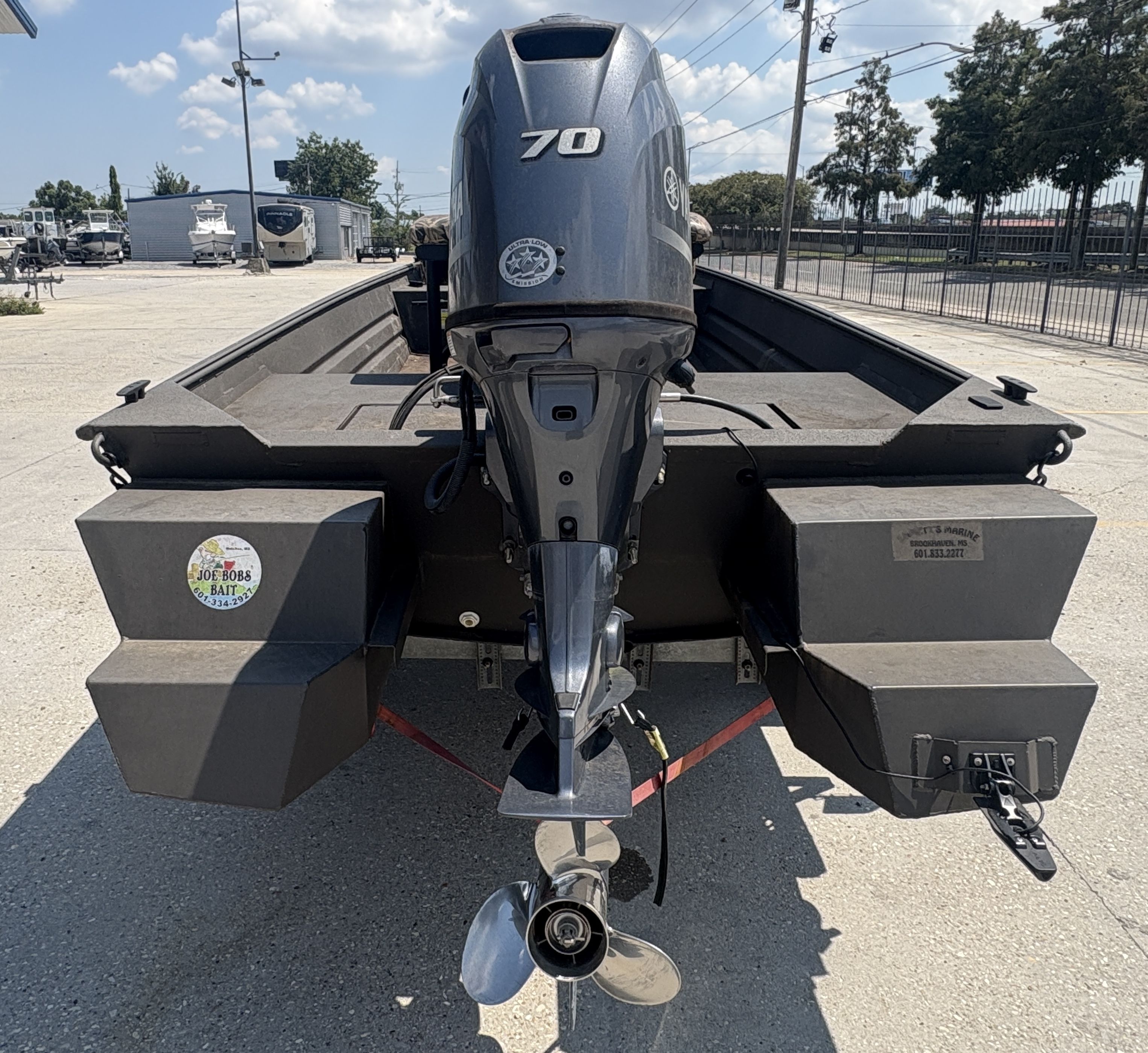 2023 Alweld 16x52 Marsh boat with Yamaha 70 outboard motor, parked outdoors.
