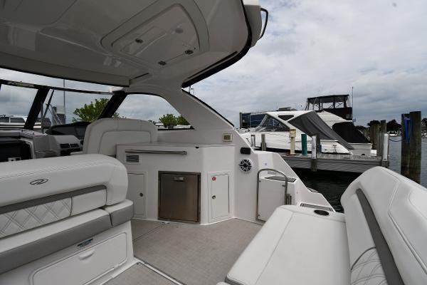 2021 Regal 35 Sport Coupe interior with luxurious seating and modern amenities at a marina.