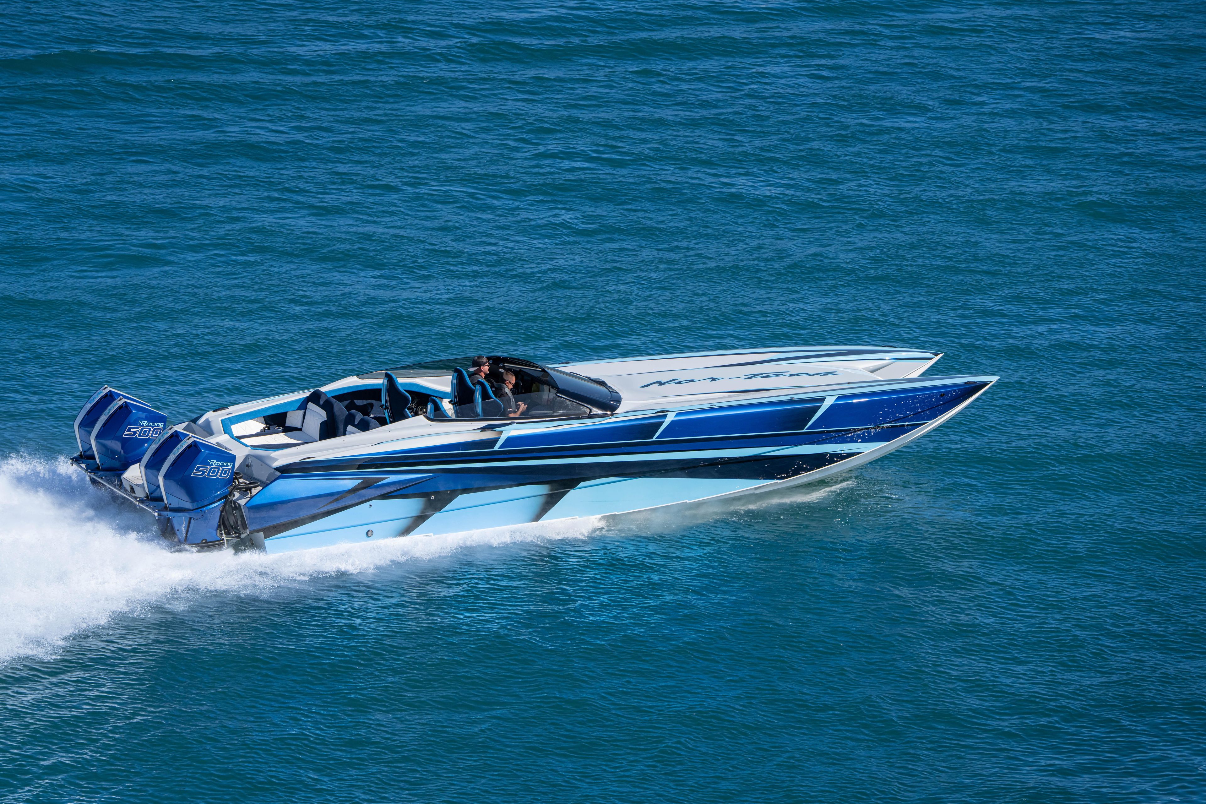 2026 Nor-Tech 4000 Super Catamaran speeding on blue ocean waters.