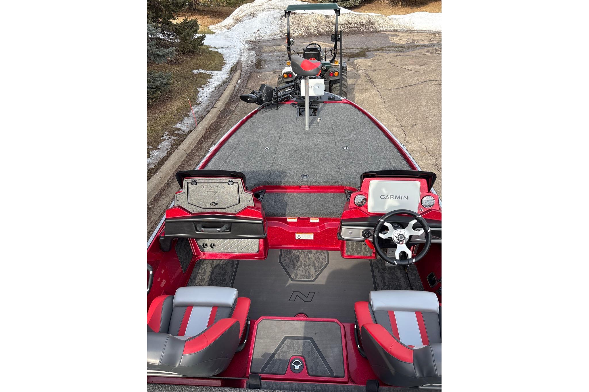 2026 Nitro Z20 XL Pro boat interior with Garmin navigation system, red and gray seating.