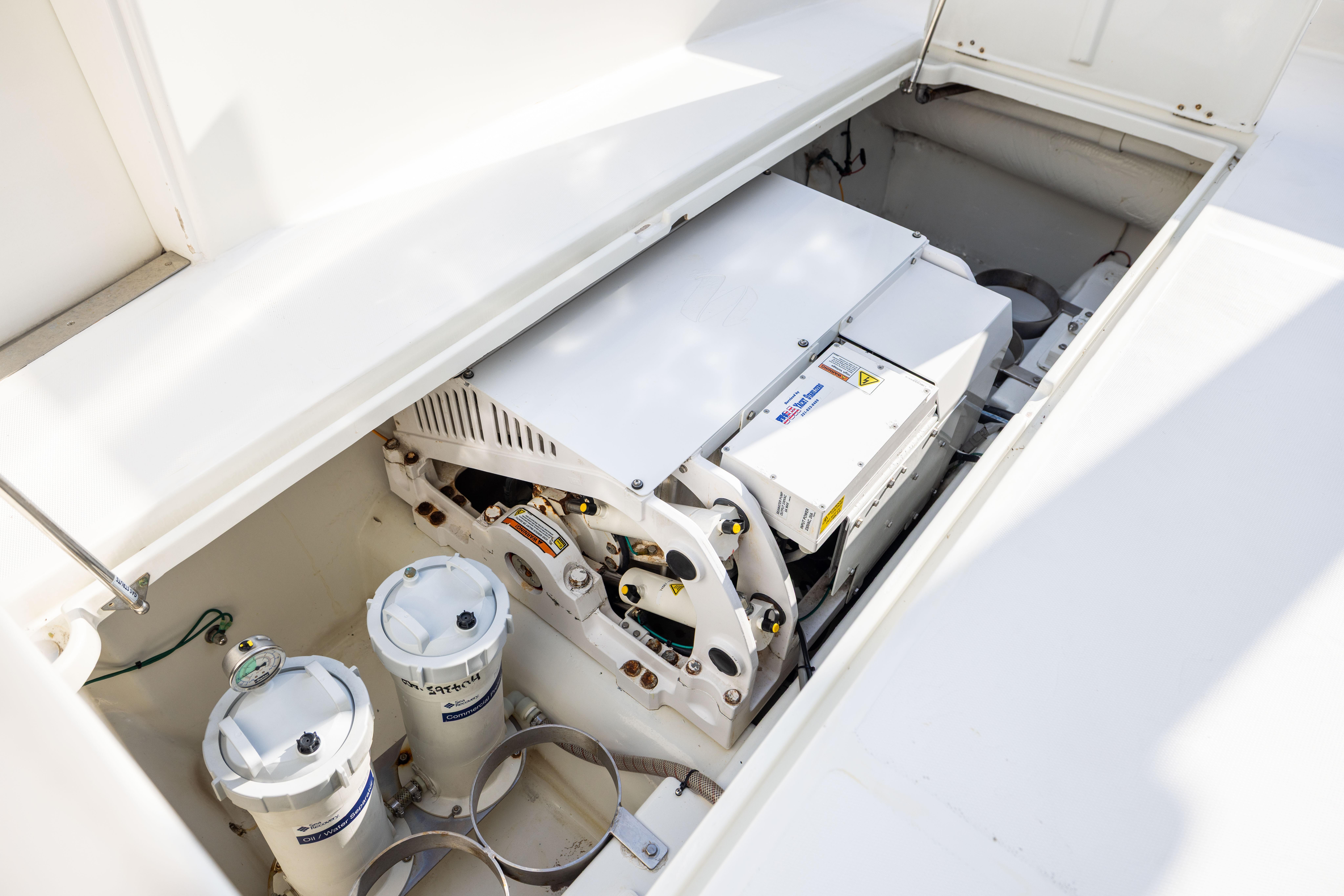 Engine compartment of 1984 Ocean Yachts 55 Super Sport, showcasing mechanical components.