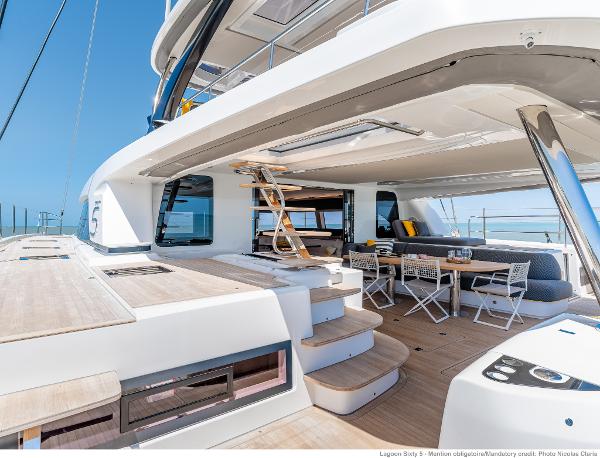 Luxurious 2025 Lagoon SIXTY 5 yacht with spacious deck and modern seating area.