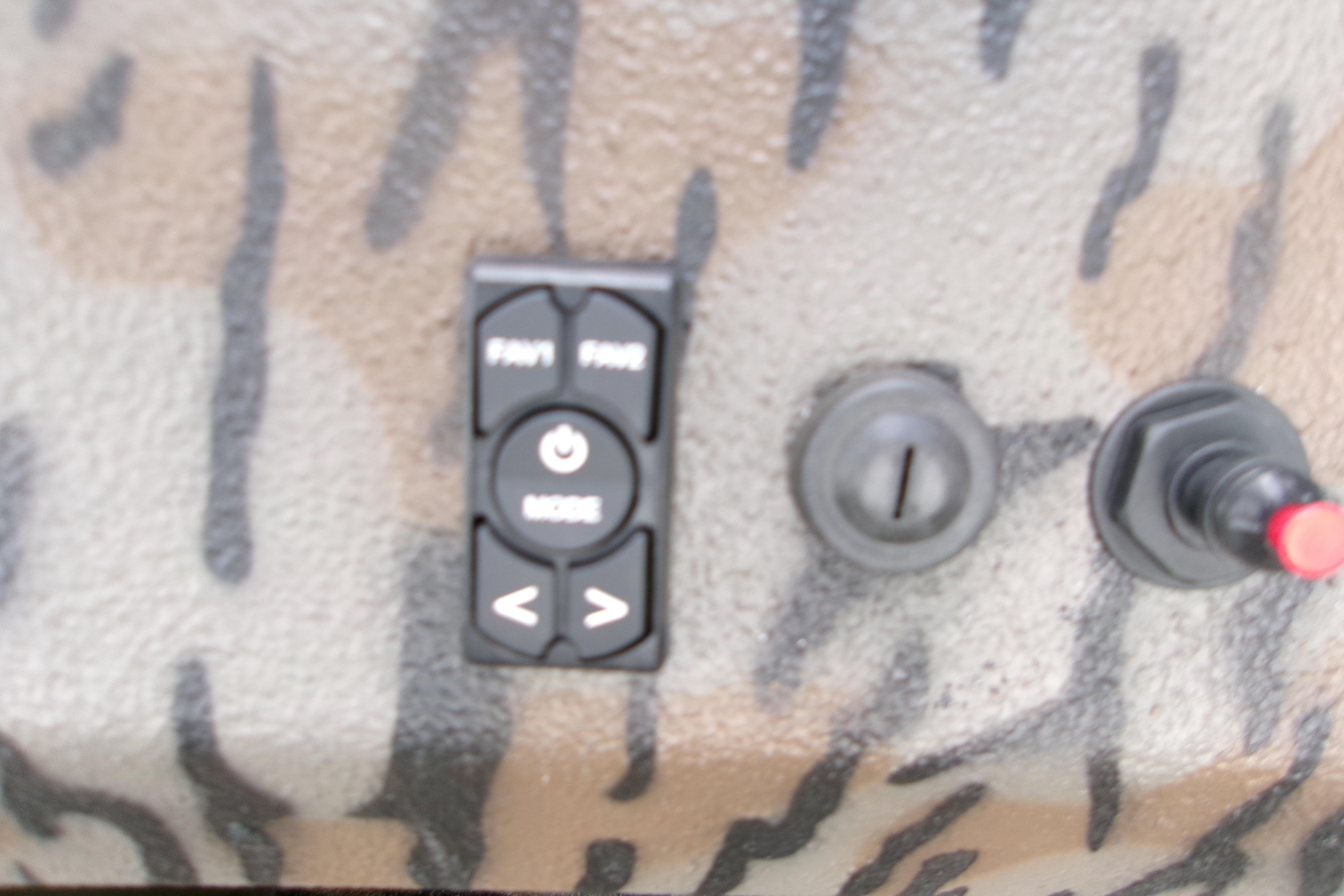 Control panel of 2026 Xpress Bayou 180CC boat with camouflage design.