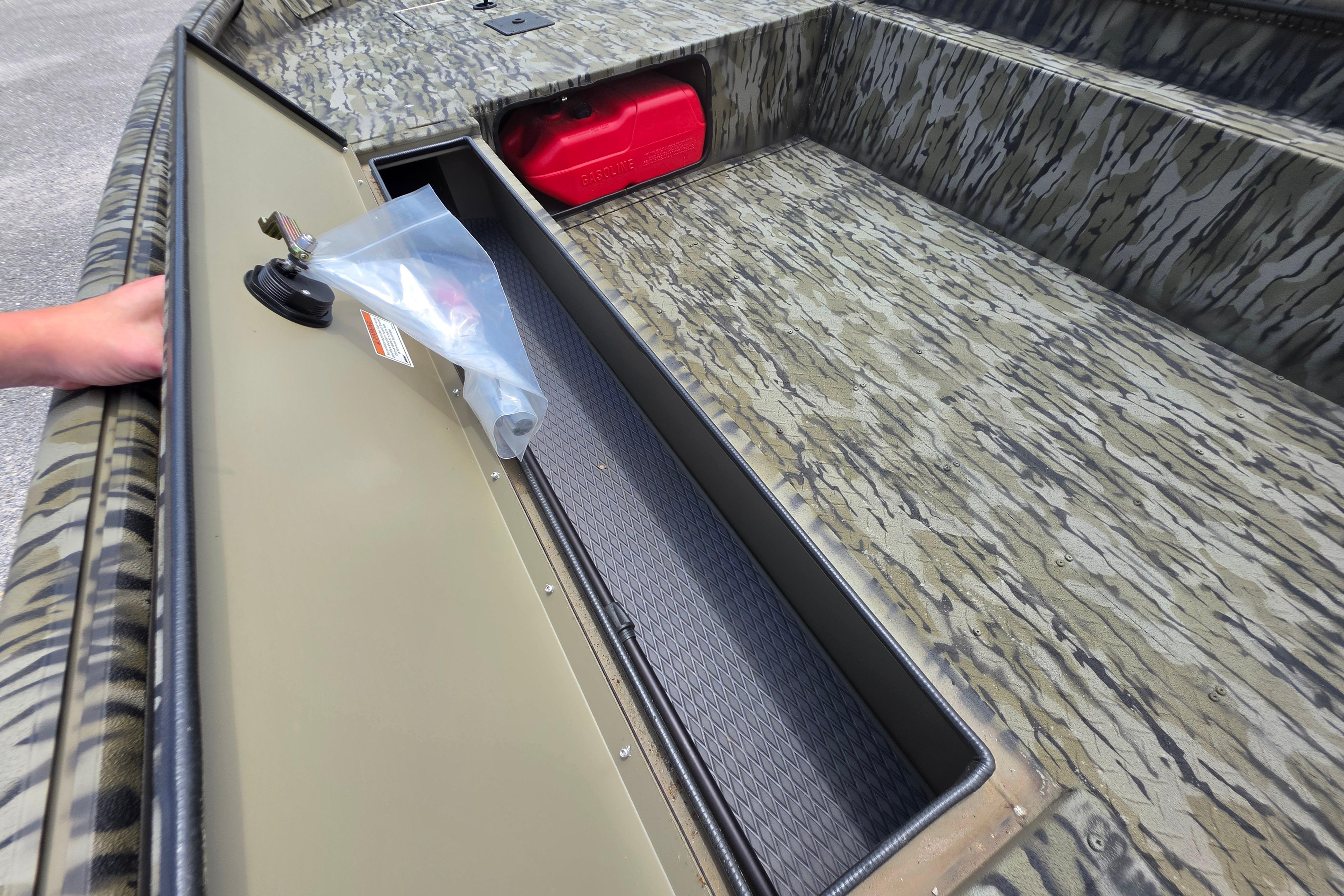 2025 SeaArk 1752 Slayer boat interior with camouflage design and storage compartment.