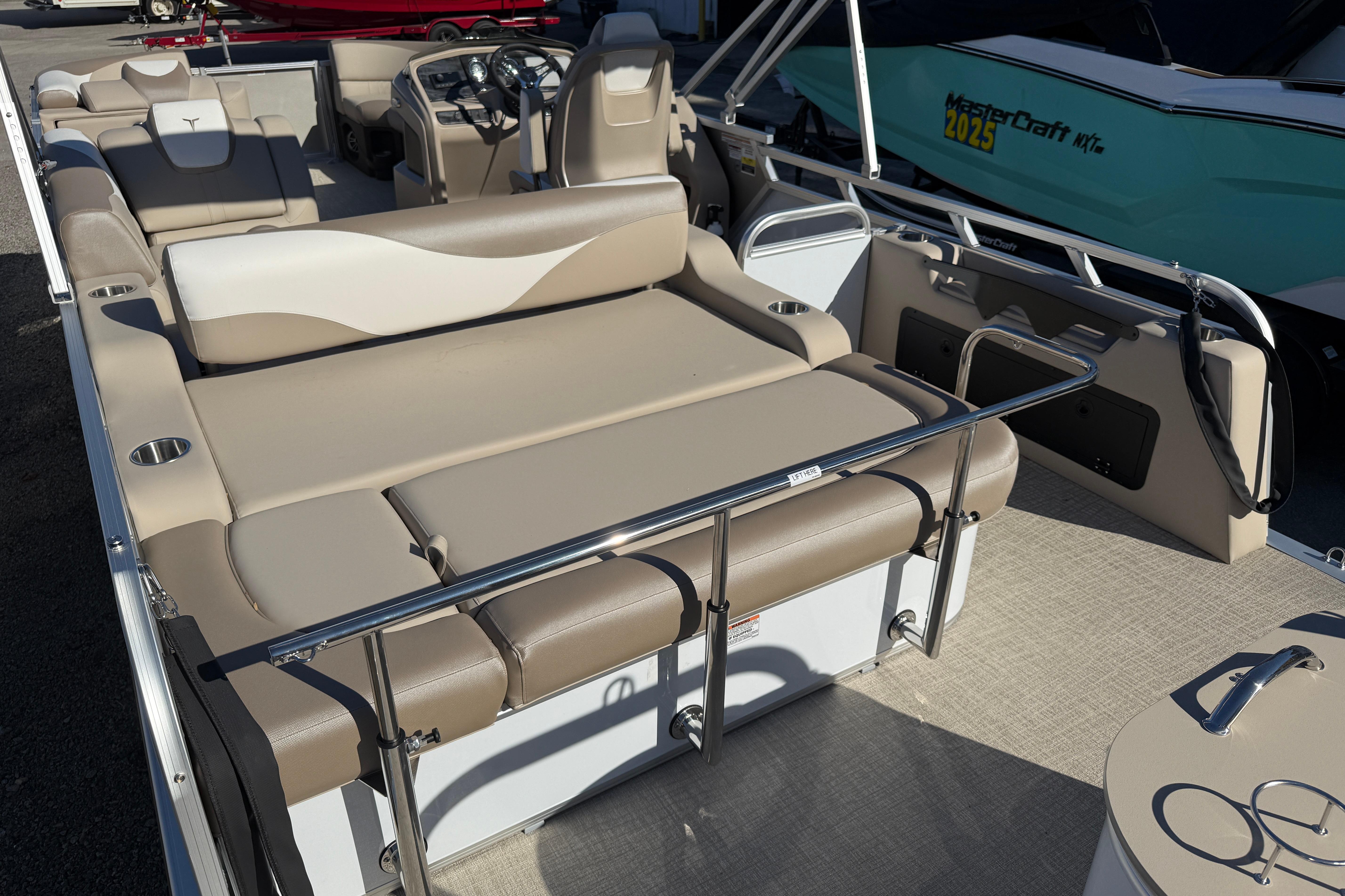 2026 Tahoe Pontoon LTZ Versatile Rear Lounger with beige seating and modern design.