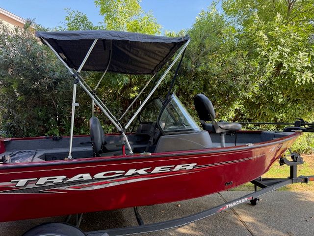 2023 Tracker PGV16WT 16 in red with a black canopy.