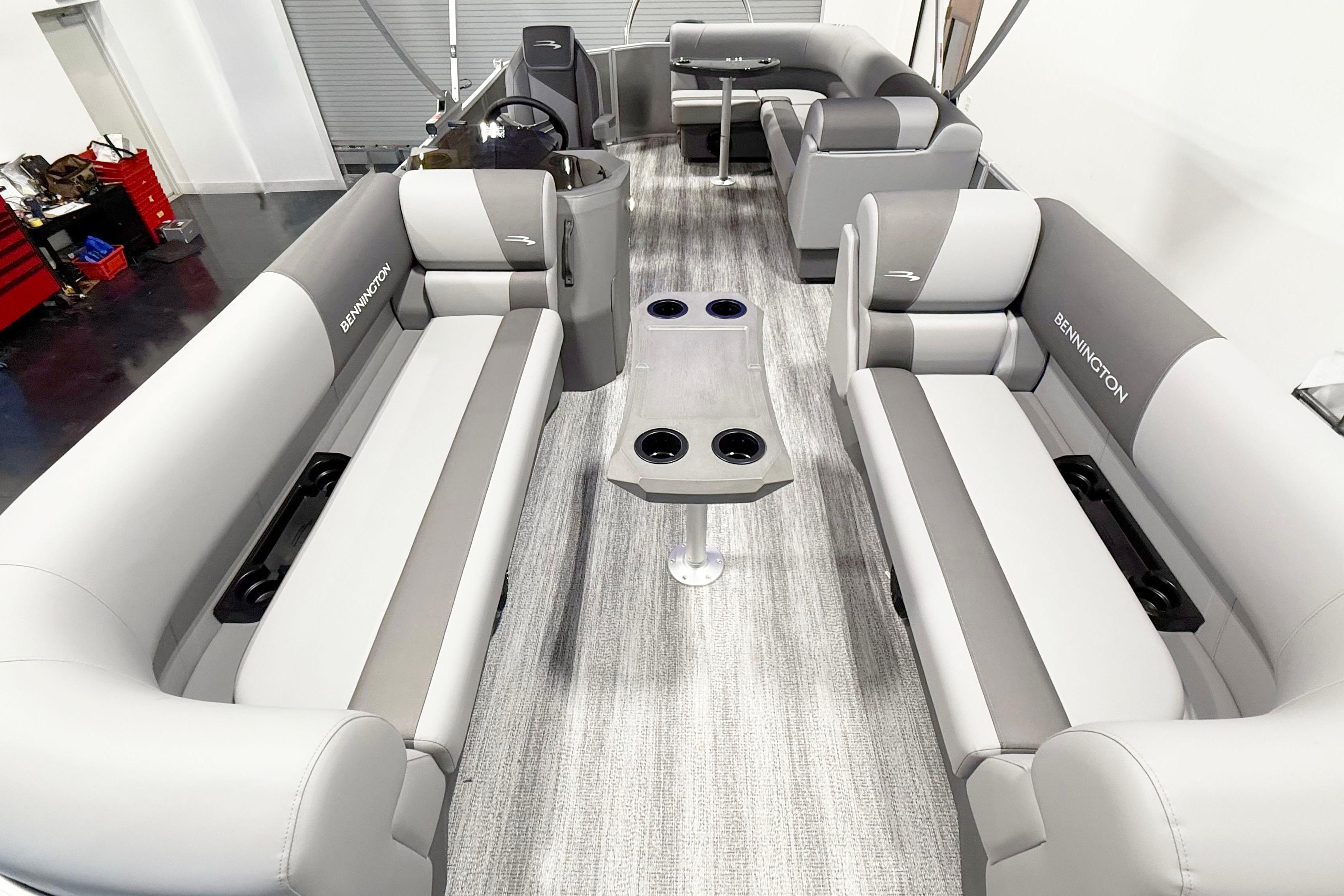 2025 Bennington 21S Cruise interior with gray seating and cup holders.