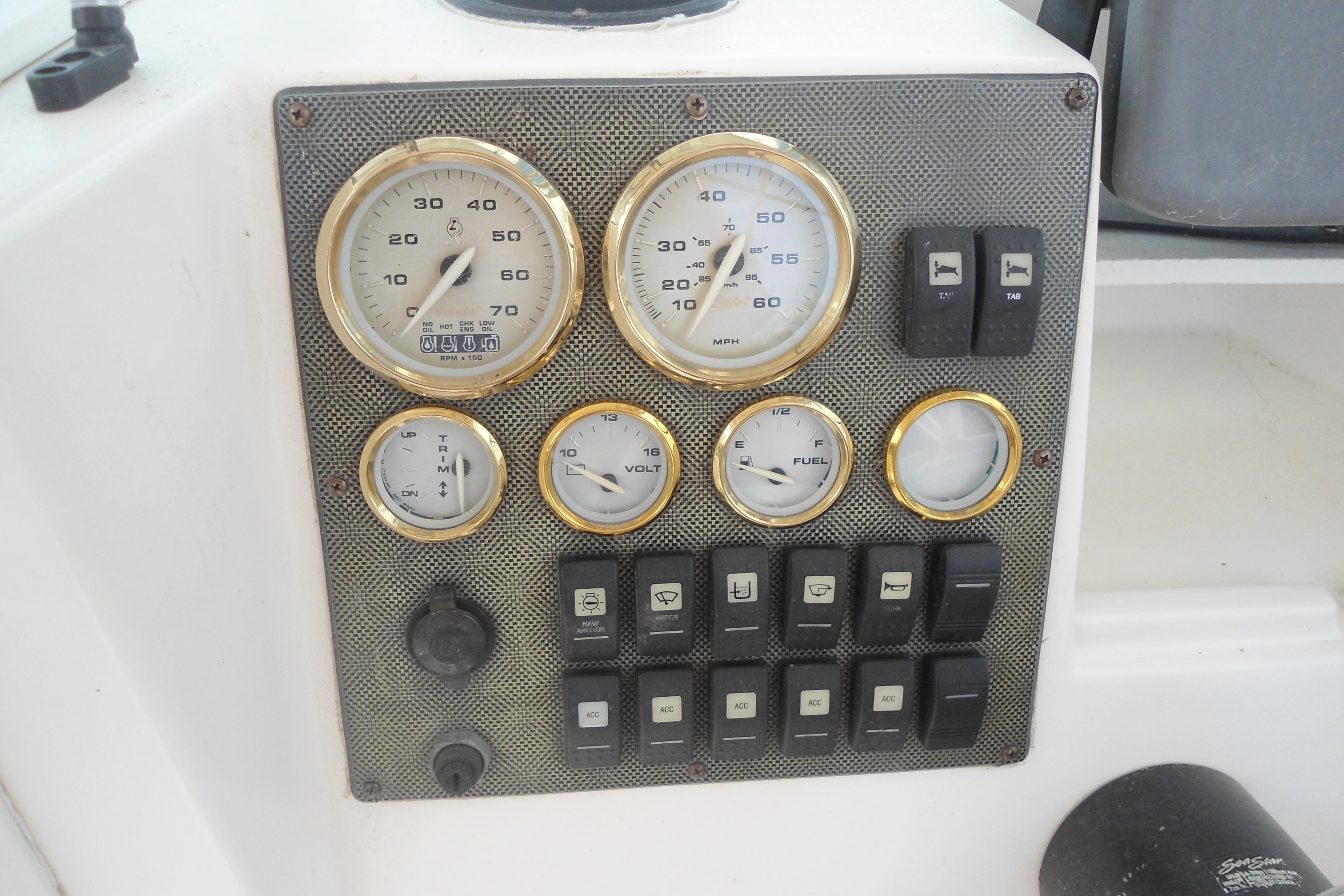 Instrument panel of 2008 Seaswirl Striper 2101 Walkaround OB boat with gauges and switches.