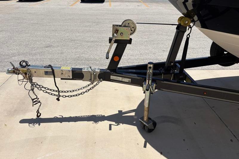 Trailer hitch of a 2007 Sea Ray 240 Sundeck boat on pavement.