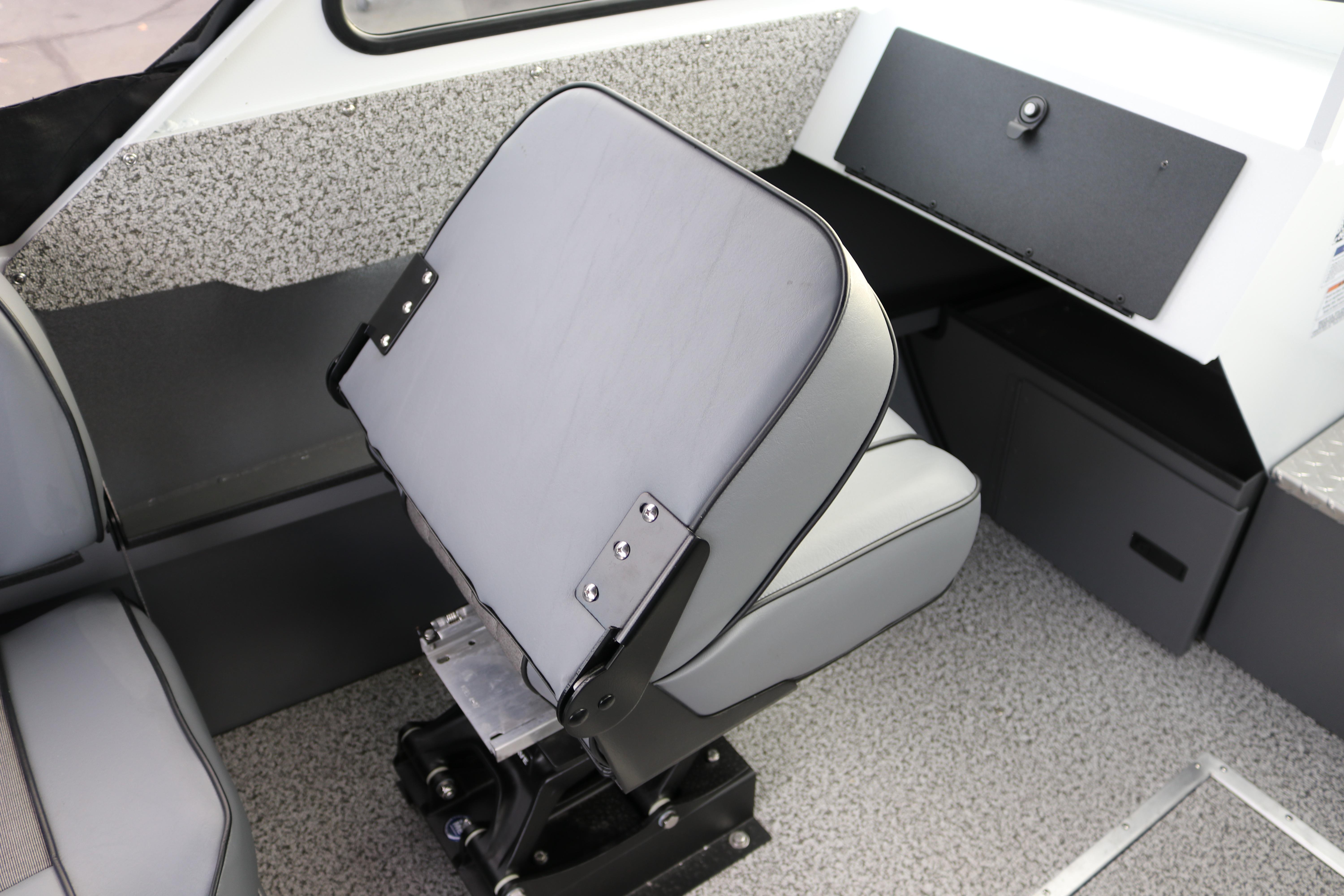 2026 Alumaweld Intruder Outboard 22 interior with adjustable seating and modern dashboard.