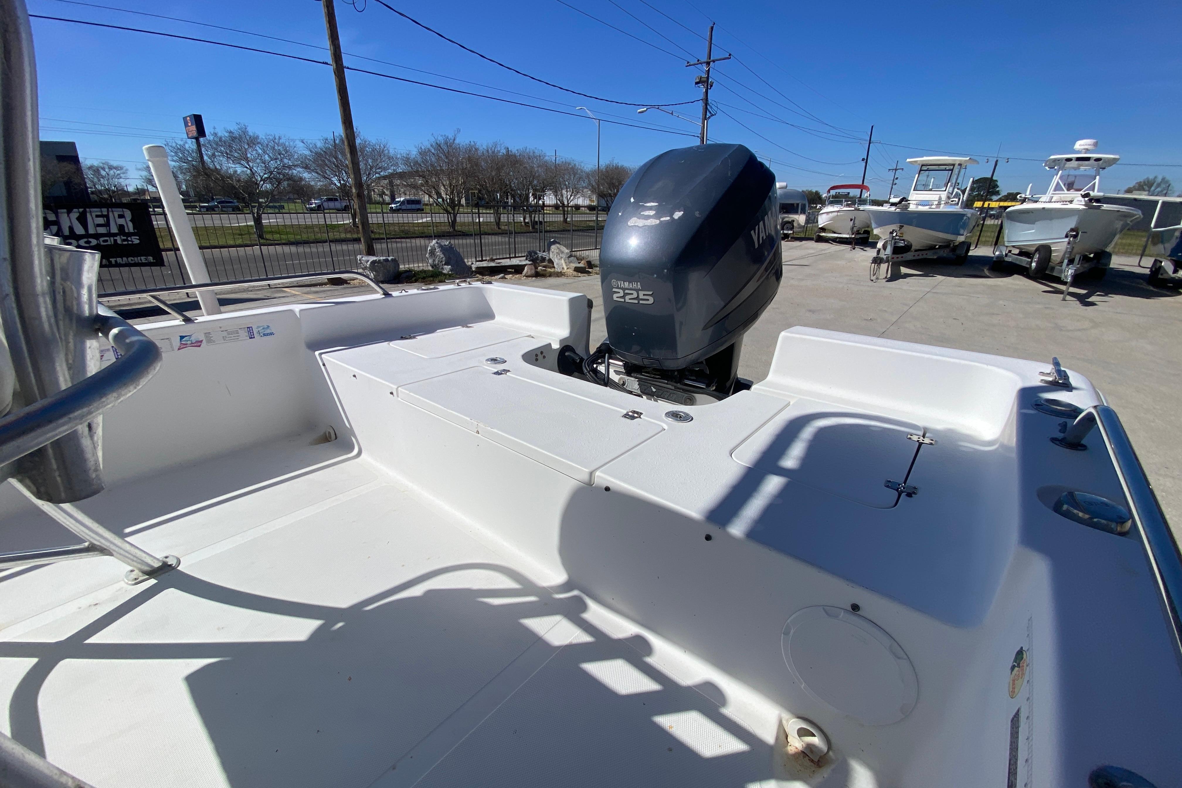 2005 Sea Pro SV2400CC Bay Boat with Yamaha 225 engine, parked outdoors.