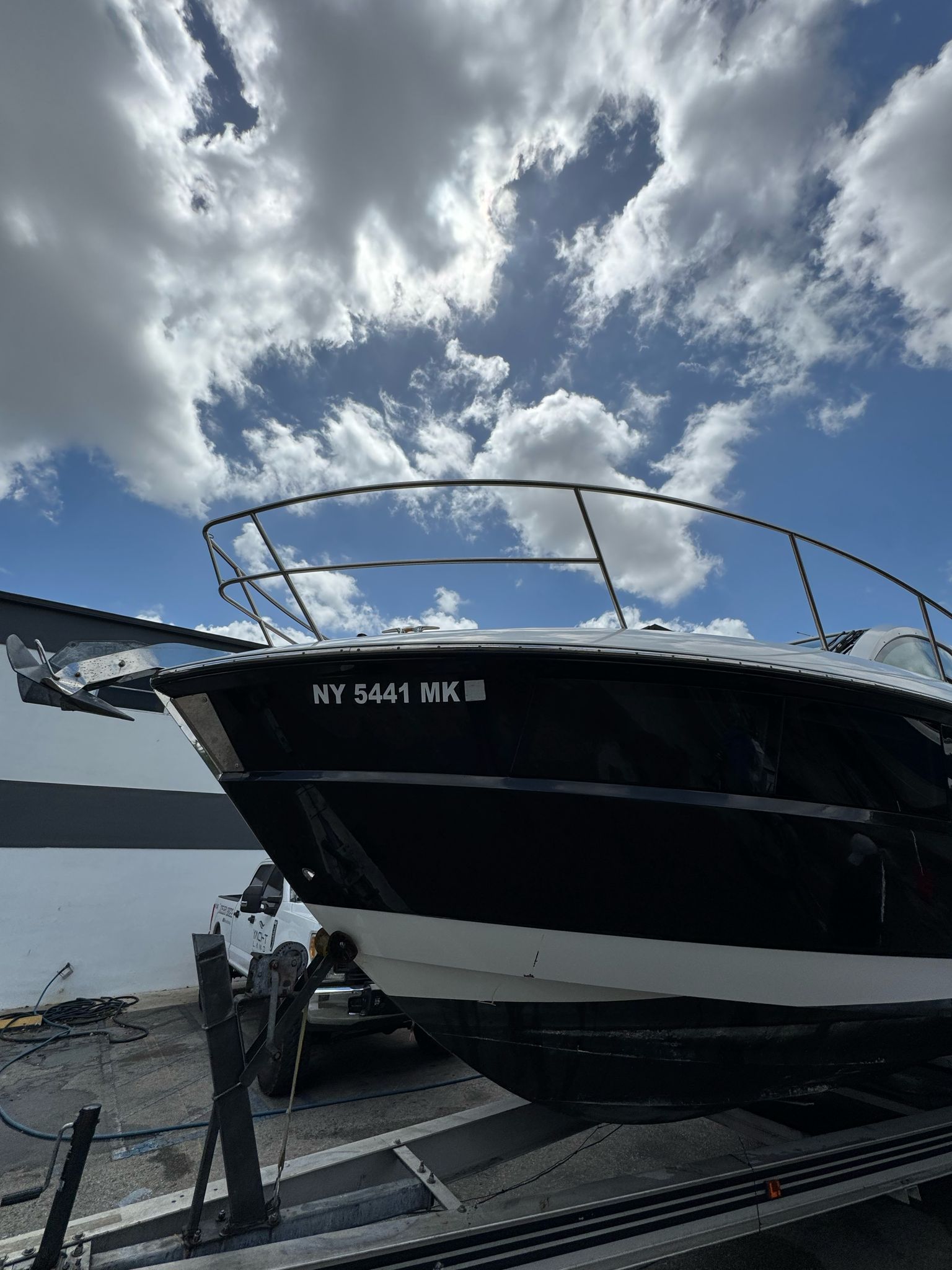 2015 Monterey 360 Sport Coupe on trailer under cloudy sky.