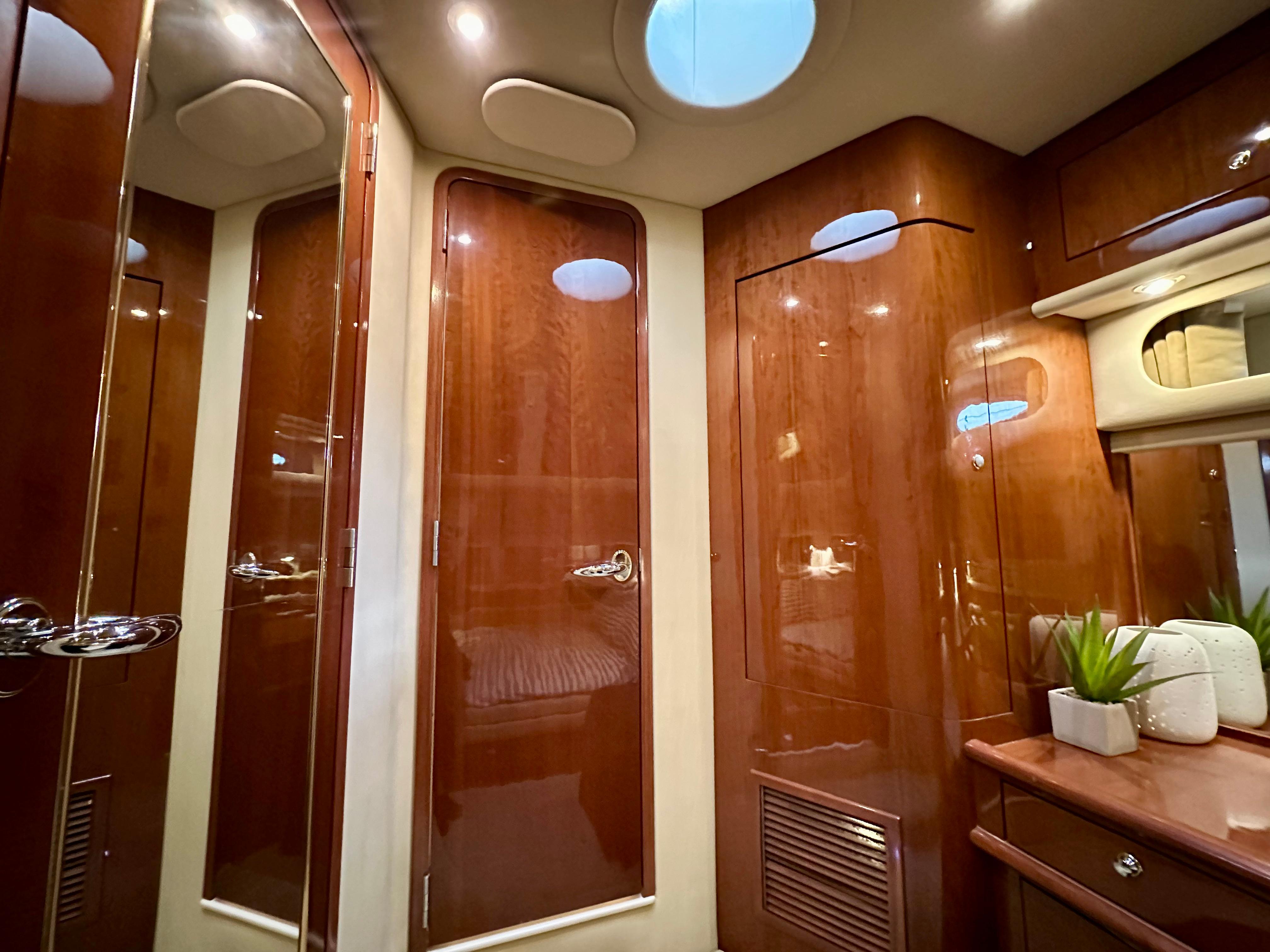 Luxurious interior of 2002 Sea Ray 560 Sedan Bridge yacht with polished wood finishes.