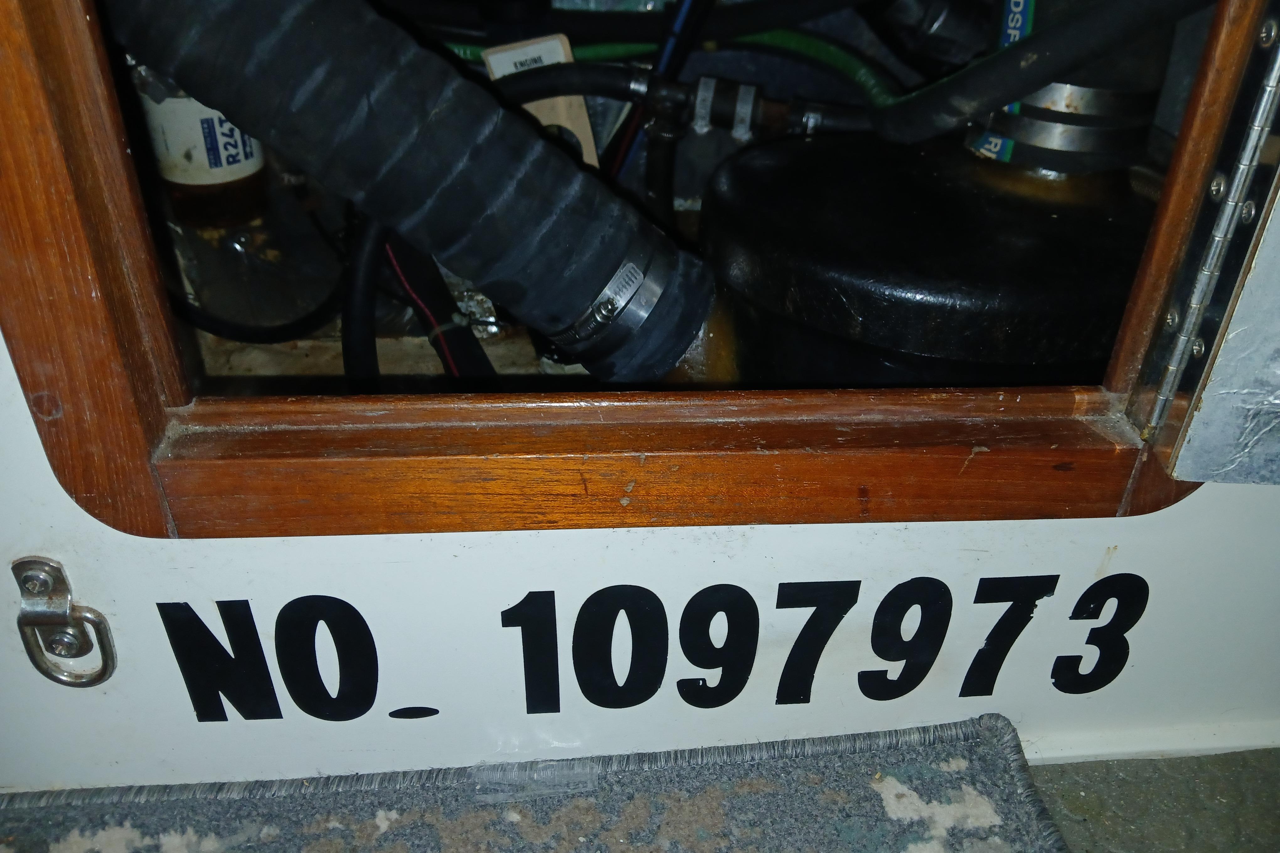 Engine compartment of a 1995 Catalina 42 MkII sailboat with visible serial number 1097973.