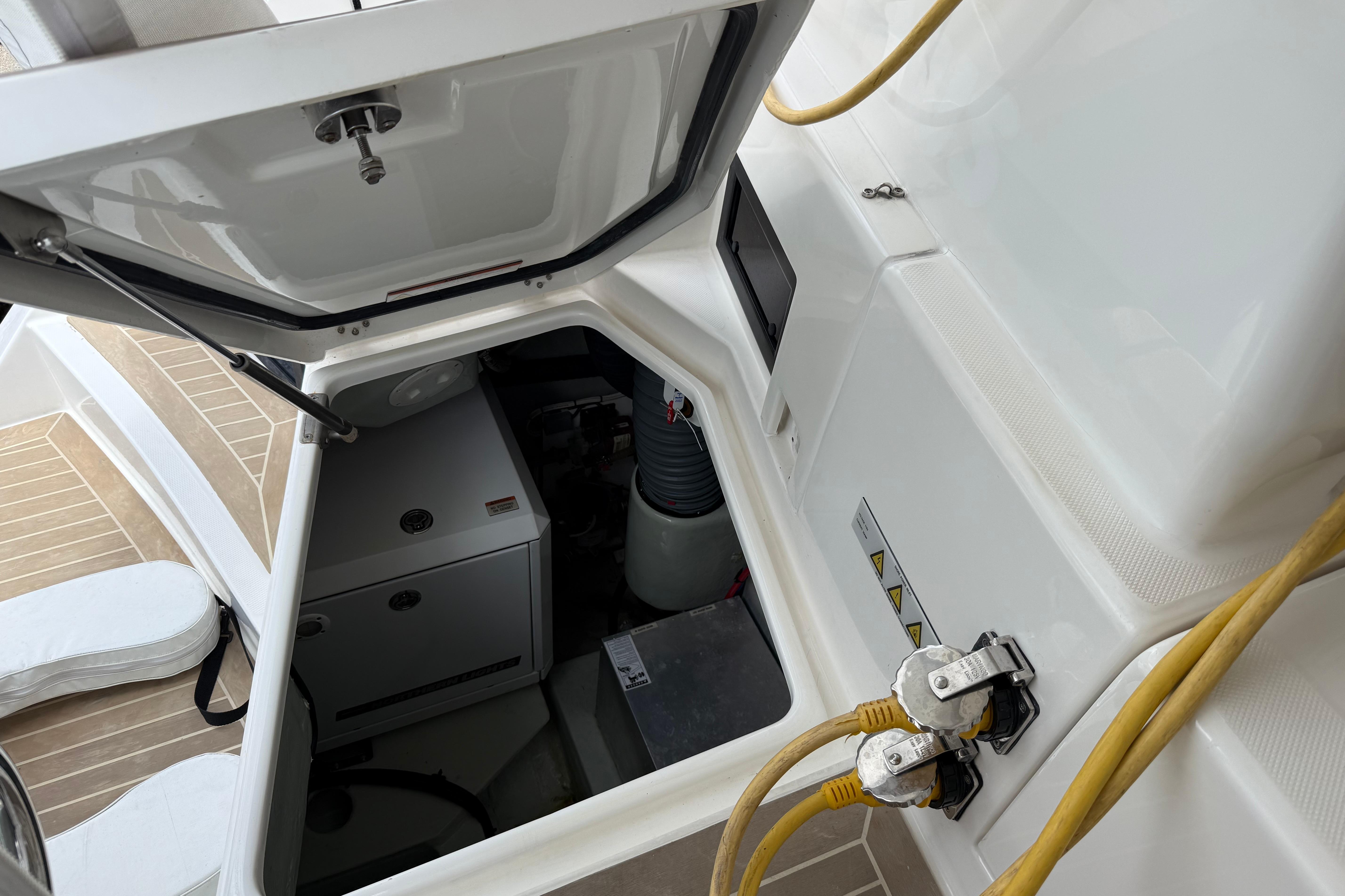 Engine compartment of a 2021 Leopard 43 Powercat with visible cables and equipment.