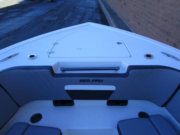 2025 Sea Pro 292 Offshore boat interior, featuring sleek seating and storage compartments.