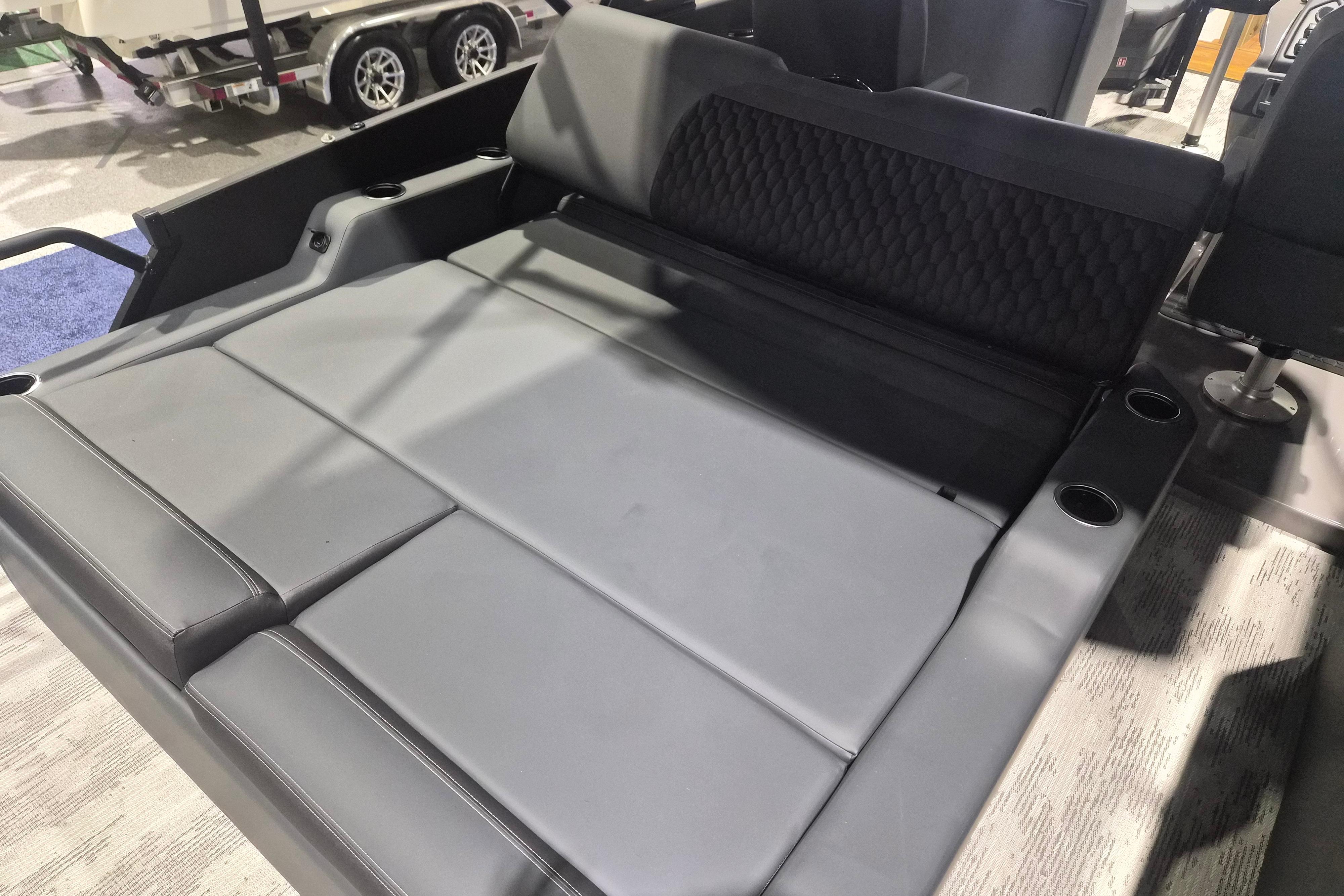 Luxurious seating area in the 2026 Sylvan L3 ULZ boat, featuring sleek gray upholstery.